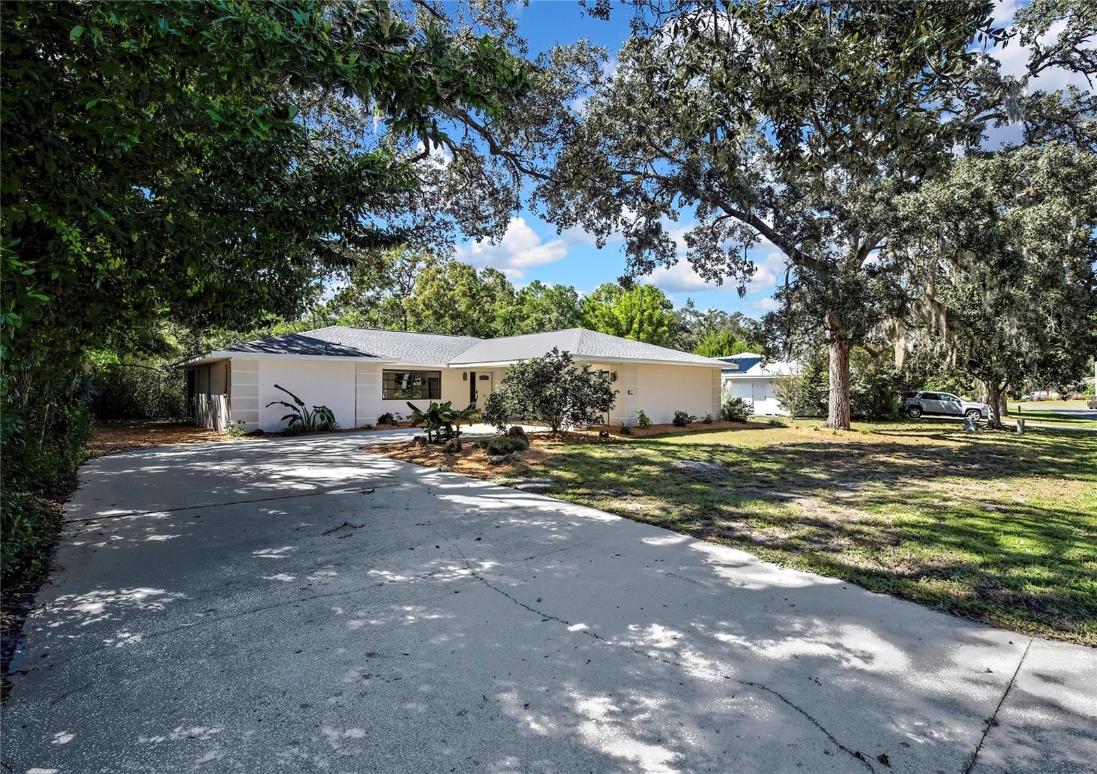 MOVE-IN READY & COMPLETELY UPDATED! NEW ROOF! LOW HOA! This beautifully renovated 3-bedroom, 2-bathroom home with a 2-car garage is located in the highly desirable GOLF community of Sugarmill Woods. Featuring a MODERN open layout and impeccable upgrades throughout, this home shows like new and is ready for its next owner! Step inside and fall in love with the light and bright Eat-in Kitchen, highlighted by a LARGE picture window—perfect for morning coffee with a peaceful view. The kitchen also boasts brand-new stainless steel appliances, stunning granite countertops, and plenty of cabinet space. The entire home has been FRESHLY PAINTED inside and out, and features NEW luxury vinyl plank flooring in the main living areas and NEW plush carpeting in all bedrooms. Both bathrooms have been tastefully remodeled with updated vanities, granite countertops, fixtures, and finishes to reflect today’s style. The owner’s suite offers a private retreat with a large walk-in closet and beautifully updated en-suite bath with double sinks. You’ll also appreciate the large, updated laundry room—a rare find! This space includes a brand-new washer and dryer, storage shelving, and plenty of room to organize and fold, making laundry day a breeze. Enjoy Florida living on the EXAPANSIVE screened lanai—a peaceful outdoor space perfect for relaxing or entertaining with great privacy. The home also includes NEW ROOF, updated landscaping, and excellent curb appeal! Located in the BEAUTIFUL community of Sugarmill Woods OAK Village, you’ll enjoy very low HOA fees—just $155 a year! Conveniently close to shopping, dining, medical facilities, and schools, plus some of Florida’s best natural attractions: Homosassa Springs, Crystal River (swim with manatees!), Buccaneer Bay Water Park, Weeki Wachee River kayaking, Pine Island sunsets, fishing, boating, and the Gulf are all just minutes away.