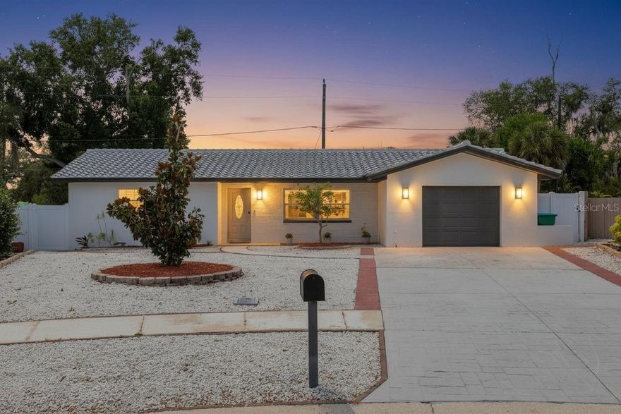 Discover elevated living in the heart of Seminole with this beautifully renovated 3-bedroom, 2-bathroom 1-car garage home offering luxury living and top-tier owner upgrades. Located on a quiet cul-de-sac in a highly desirable A-rated School District, just  minutes from the Gulf Beaches, Seminole Mall and fine dining. Nothing has been spared, every detail of this home has been carefully designed and ready for buyers with high expectations. Step inside to a wide Open Floor Plan featuring luxury waterproof vinyl flooring throughout, fresh interior and exterior paint and a modern electric fireplace that creates a warm and inviting atmosphere. You will fall in love with Brand New Dream Kitchen with Quartz Countertops, top-of -the -line appliances and a Smart Hub touchscreen refrigerator, making it perfect for entertaining and daily living. Upgraded modern light fixtures elevate the overall aesthetic of the home, making it stand out. Designed with privacy in mind, the spacious primary bedroom and en-suite bathroom are thoughtfully situated on the opposite side of the home from the other two bedrooms. Both bathrooms have been fully updated with luxury tile work, new modern vanities, double sink in the guest bathroom, and upscale finishes. The dining area opens up to a double glass door that leads to a peaceful backyard porch - ideal for your morning coffee. Enjoy the Fully Fenced Backyard for privacy, fresh green grass, additional Storage Shed and Well Sprinkler System. Newly paved double driveway. Washer /Dryer Hookup in Garage. Major Updates include New Clay Tiled Roof 2025, Newer Windows, AC unit 2021, Water Heater 2023. This home is equipped with Natural Gas Heat , Water Heater and Gas Stove. This home truly has it all - modern upgrades, thoughtful design and unbeatable Seminole Location !