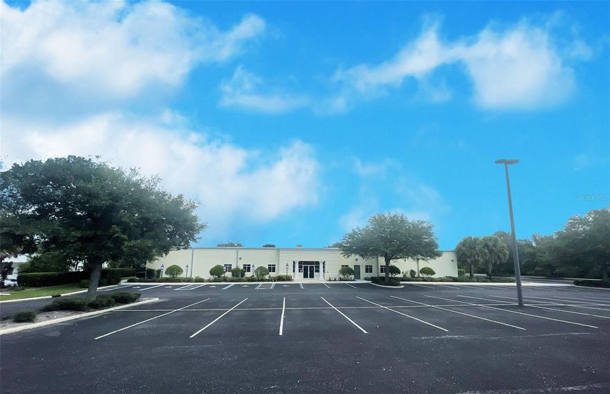 Rare Opportunity!!! 25,000+ SF building with Industrial (I) zoning in Lady Lake! A multitude of allowable uses including the (I) Industrial and (HC) Heavy Commercial use classifications. Building was a former banking operations center so has a fantastic layout of offices, large open areas, warehouse, etc. and would make an excellent conversion for many different business types. Heavy power already in place and multiple HVAC units, plus data cabling, etc. to accommodate high power and data usage needs. Approximately 5,000 SF is warehouse with the balance office/professional layout under HVAC. Huge 3.08 acre site that is landscaped and paved and has extensive parking with 100+ traditional spaces plus ADA spaces. This was a Class A facility when it was constructed and some cosmetics and general updating would very easily bring it up to today's standards. Great parking ratios, lighting, and very good signage with high street visibility. Very easy access from 441 South through The Villages and just one turn off the major artery through this highly trafficked area. Just minutes to food, shopping and amenities would make this an excellent site for large employers looking to accommodate high staffing or clientele needs.