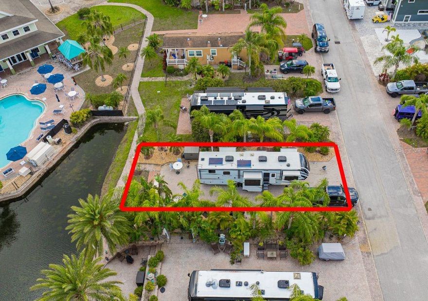 Own Your Piece of Paradise – Developer’s Closeout Opportunity!
Imagine waking up to the beauty of swaying palm trees, a tranquil water view, and the vibrant energy of an exclusive clothing-optional, gated RV community. Located at 6770 Amanda Vista Circle in Land O Lakes, Florida, this 90’x40’ premium RV lot offers the perfect blend of luxury, privacy, and convenience. Designed for relaxation and entertainment, the lot features beautiful brick pavers and built-in seating overlooking the water, all just steps from the clubhouse and pools.  This lot has a 100 amp full hookup and Verizon fiber optic is available at the street.
This community is rich in amenities, including two sparkling pools, a relaxing hot tub, a lively tiki bar, and a dog park for your furry companions. Beyond the gates, you’re perfectly positioned near top golf courses, premier shopping, fine dining, and the Tampa airport. Plus, with Caliente Resort right next door and other clothing-optional resorts nearby, this location is ideal for those who embrace an active, carefree lifestyle. Caliente is just a golf cart drive away and offers a variety of membership options.
With the developer’s closeout underway, this is a rare opportunity to secure one of the last available lots in this exceptional community. Whether you're looking for a seasonal retreat or a permanent escape, this mature, tropical oasis is the perfect place to call home.