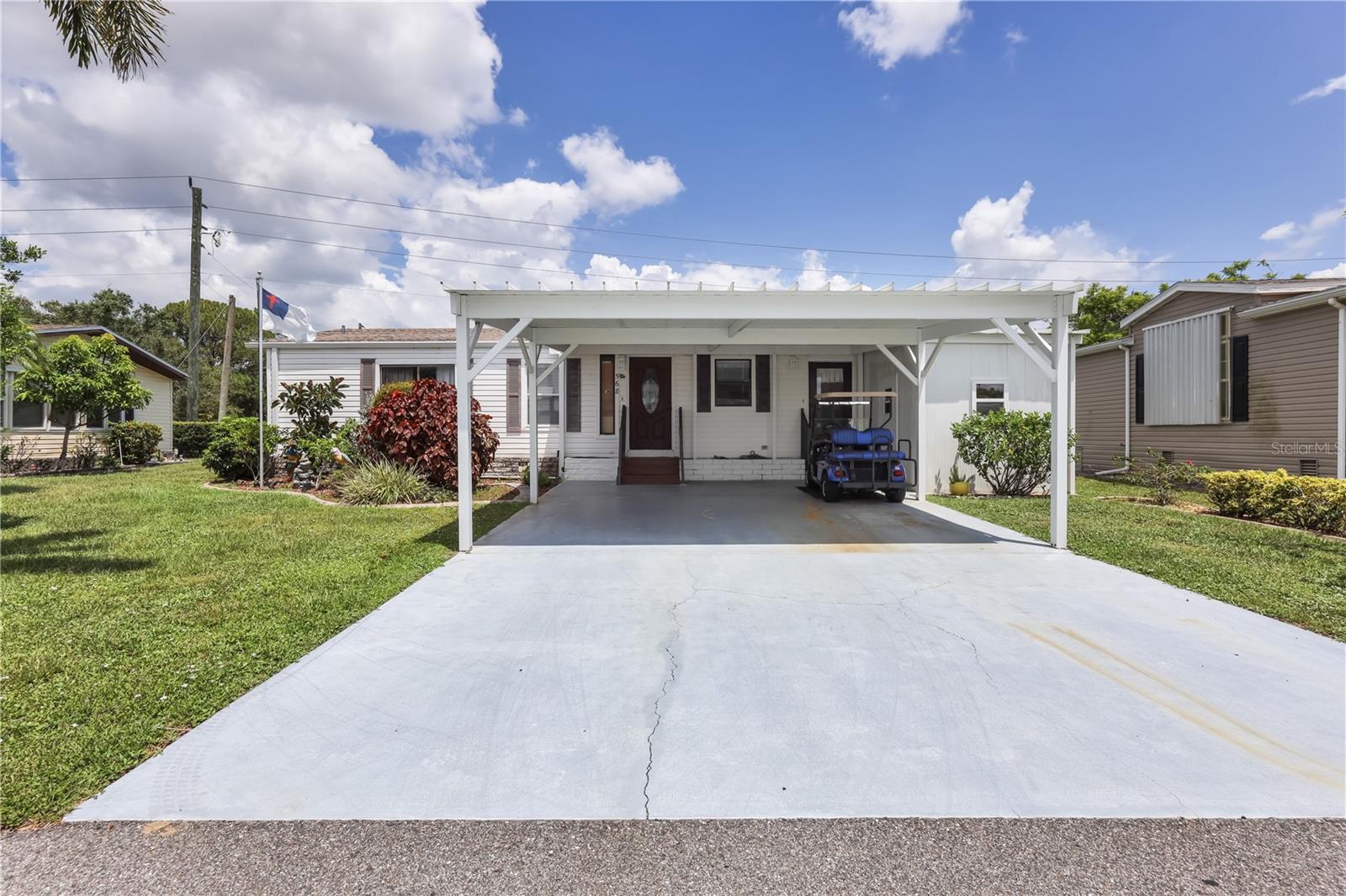 This 1986 Three bedroom Jacobsen built home is sure to please. Located on the back east side of the community on a perimeter lot with a horse paddock view. The 23 foot wide driveway is perfect for those with more than one vehicle. Interior laundry for added convenience. The split bedroom floor plan is perfect for entertaining overnight guests with primary bedroom suite on one side the home and guest rooms on the other. The two guest bedrooms share the second bathroom. On the exterior, 80sq ft storage shed and spacious 168sq ft lanai and 156sq ft screened and covered patio. AC and duct work replaced 2017, new carport 2023. Home being sold furnished. ***Be sure to check out the two virtual tours for video walk through and 3-D virtual*** Maple Leaf is a resident owned 55+ community with an active resort lifestyle. Activities include award winning par 62, 18 hole golf course, 4 heated swimming pools, 5 tennis courts, bocce, lawn bowling, 2 shuffleboard court centers, 2 hot tubs, sauna, fitness center, woodworkers shop, pottery studio, 4 pickleball courts, two restaurants, full service bar, tiki hut with bar and over 75 clubs and activities. Price of home includes membership certificate.
