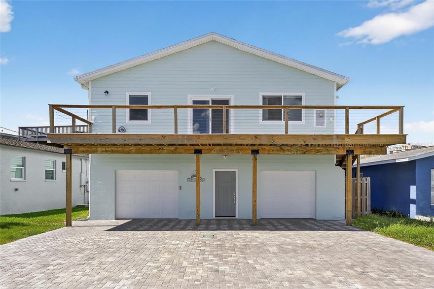 Improved Price! Dreaming of the beach life? Come for a visit to this 3/2/2, 2-story, move-in ready home only a few blocks from your private beach access! Make a day of it and catch the sunset on the beach! This lovingly maintained home has been freshly painted, outfitted with new exterior fiberglass doors which won't weather or warp and its pavers resealed for its new Owners. Downstairs you'll find covered parking for two vehicles as well as a huge workshop space for all your hobbies. A fenced-in garden awaits a fire pit or your four-legged friends. Once upstairs, you'll immediately notice the light and airy feel of the open concept kitchen and living area and the sliding glass doors leading to your ample wooden deck with water views and coastal breezes; perfect for your morning coffee, an evening beverage or grilling out. The immaculate kitchen with all stainless steel appliances is bathed in natural light and has abundant storage.  It's a home made for entertaining with its oversized stone top kitchen island and adjoining living area with easy-care, wood-look vinyl flooring. Enter the large primary bedroom for more water and palm tree views. The ensuite restroom is complete with a water closet, water-resistant cork flooring, a large shower with multiple shower heads, a built-in bench and a window for natural light. It's like having your own private spa! It gets better...walk through to find your enormous walk-in closet anyone would envy. The second bedroom is perfect as an office or den and the third bedroom will comfortably host family or friends. A second full bathroom holds a jetted tub for weekend or anytime relaxation. When you're not enjoying your beautiful, low maintenance home, stroll, jog, bike or ride to the shore, local eateries like the famous Candy Kitchen, a community playground or to the many local live music venues nearby. Don't wait to lock down one of the few, move-in ready, two-story homes on the market in Redington Shores. There's nothing like the beach life! Come find out for yourself.