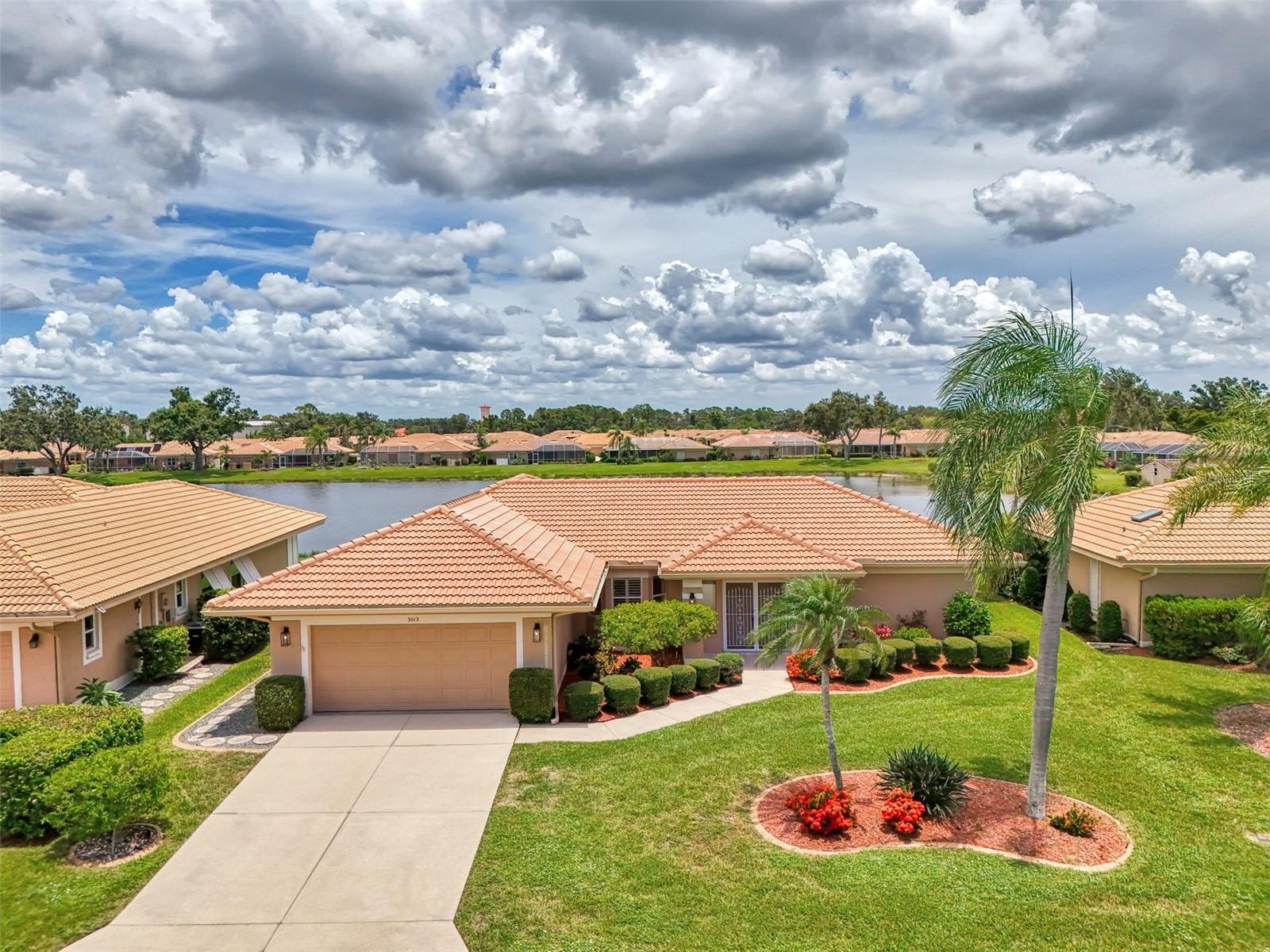 Move-in Ready with a Stunning Lake View! Homes in Willow Springs Dont come for sale often and this one is a gem ! This beautifully maintained home is ready for its new owner with all the major updates already completed. Enjoy peace of mind with a brand-new tile roof (2025), updated electrical service (2024), new stainless steel appliances (2024), a new 50-gallon water heater (2025), and new flooring installed in 2025—no carpet anywhere. A new pool cage (2023) enhances the outdoor space, perfect for relaxing or entertaining. As you walk through the front door, you’re immediately greeted by serene lake and pool views. Inside, everything is neutral and spotless, making it easy to add your personal touches.Located in a vibrant community offering tennis, pickle ball, shuffleboard, and a community center with a pool, there’s always something to do. Home is located in an excellent location close to Venice Beaches, Venice's vibrant downtown with lovely restaurants and entertainment. Wellen park , the Atlanta Braves spring training camp and I 75