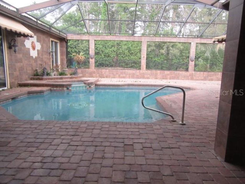 Photo of 9460 Bearfoot Trail, Weeki Wachee, FL 34613 (MLS # TB8496076)