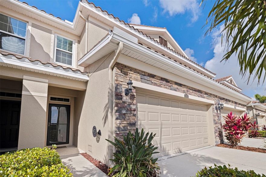 SPACIOUS 3 BEDROOM GATED TOWNHOME WITH POND VIEWS, IMPACT WINDOWS & DOORS, BONUS ROOM, LOW HOA FEES & PRIME ST. PETE LOCATION OFF 4TH ST N.
Located in The Colonnade, a beautifully maintained gated DR Horton community just off 4th Street N, this spacious 3 bedroom, 2.5 bath, 2 car-garage townhome offers nearly 2,000 square feet of living space, peaceful pond views, private streets, and low-maintenance living in Flood Zone X where flood insurance is not currently required.

The open floor plan creates an inviting flow between the living room, dining space, and kitchen. The kitchen features solid wood cabinetry, pantry storage, pendant lighting, and a large breakfast bar ideal for casual dining and gathering with friends and family. Sliding glass doors lead to the screened back lanai overlooking the pond, creating a peaceful outdoor space to enjoy morning coffee, visiting birds, and beautiful sunset views.
Upstairs, a versatile bonus room provides flexible space for a home office, workout area, media room, or second living space. The spacious primary suite offers tray ceilings, abundant natural light, dual vanities, a glass-enclosed walk-in shower, linen storage, and a generous walk-in closet. Two additional guest bedrooms each feature walk-in closets, tall ceilings, and share a full hall bath.
Major improvements include new impact windows & doors (2024), new HVAC (2025), interior paint (2023), and new carpet (2023). Additional highlights include plantation shutters, glass storm door, 2024 LG front-loading washer and dryer, exceptional storage throughout, and a large 2-car garage.
Residents enjoy gated access, beautifully maintained landscaping, a resort-style pool, covered pavilion with outdoor kitchen, fireplace lounge, and a clean, organized community atmosphere with limited street parking that helps preserve curb appeal throughout the neighborhood, for only $326/month HOA fee.
Conveniently positioned near the front of the community, the home is located next to additional guest parking, mailboxes, and the pool area for easy everyday access. Located minutes from downtown St. Petersburg, I-275, Tampa, Shorecrest Prep, Whole Foods, Trader Joe’s, Publix, Target, Starbucks, Fresh Market, Bonefish Grill, Metro Diner, waterfront parks, and countless restaurants and shops, this home offers the ideal balance of comfort, convenience, and low-maintenance living.
