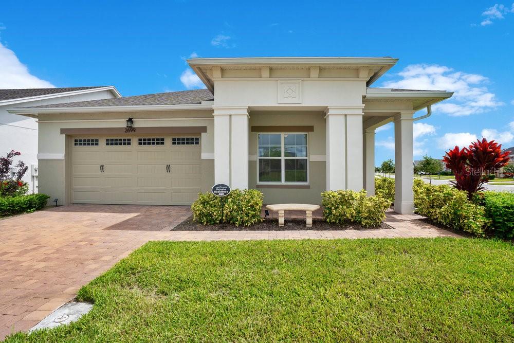 Motivated Seller! This beautifully appointed "Marco" 3-bedroom, 3-bathroom Jones Homes offers the perfect blend of livable comfort, charm and sophistication. Located on a corner lot with tranquil water views in the premier 55+ gated community of Twin Lakes in Central Florida, this is the rare opportunity you have been waiting for. Curb Appeal, First Impressions, & Backyard Views - Step onto the spacious front porch and soak in the Florida sunshine while enjoying the warm sense of community that Twin Lakes is known for. Triple sliding doors effortlessly open and tuck away where you'll discover your own piece of paradise in the expansive screened lanai creating a seamless transition between your indoor retreat and your private outdoor oasis designed for year-round enjoyment. Unwind as the vibrant hues of the Florida sky paint a spectacular backdrop each evening over the water. Gourmet Kitchen, Open Living, Seamless Flow - The heart of the home shines with flexibility of the living and dining area with soaring 10’ ceilings, 8’ doors, and a thoughtfully designed 3-way split floor plan which immediately creates an inviting sense of openness. The chef-inspired kitchen is perfect featuring a magnificent granite island complemented by 42” cabinetry with crown molding and Whirlpool appliances. Experience the culinary delights of a natural gas cooktop with a powerful range hood that vents to outdoors. The convenience of the butler's pantry will cater to your lifestyle offering generous storage for all your culinary and entertaining needs. Private retreats for owners and guests - This home features two private ensuites with floor to ceiling shower tiles in all bathrooms. The primary suite is a true sanctuary with tray ceilings, space for a cozy sitting area, and a generous walk-in closet. The spa-like primary bathroom includes a sleek glass-enclosed shower with dual shower heads for a customizable bathing experience. The flex bonus room offers endless possibilities as a home office, media lounge, yoga studio, or private retreat.
Resort-style living at Twin Lakes - Life at Twin Lakes is a vibrant, resort-style experience centered around the Lakefront Clubhouse & Amenity Center. A full-time Lifestyle Director ensures a dynamic social calendar with various clubs and activities, from cards and billiards to multiple community events.
Stay active with a multitude of amenities including:
-Clay tennis courts, pickleball, and bocce ball
-A putting green
-Lap and resort-style zero-entry pools, a hot tub, and a sauna
-A state-of-the-art fitness center with engaging classes
For outdoor enjoyment, gather at the grill pavilion and enjoy a fire on a cool day OR explore Live Oak Lake by pontoon, John boat, or kayak that you can rent for the day. The private 31-acre lake is perfect for fishing and bird-watching with opportunities to see bald eagles soaring above. Location and lifestyle - Nestled in St. Cloud, this home offers the best of both worlds: peaceful lakeside living with convenient access to modern amenities. Historic Downtown St. Cloud, dining, and world-class bass fishing on Lake Toho are nearby. Quick access to Lake Nona/Medical City, Orlando International Airport, and the Florida Turnpike puts all of Central Florida within easy reach.
Experience the Florida lifestyle you've always dreamed of. Comfort, elegance, and an active community await you at Twin Lakes.
Your Florida dream home is here, make your private showing appointment now!