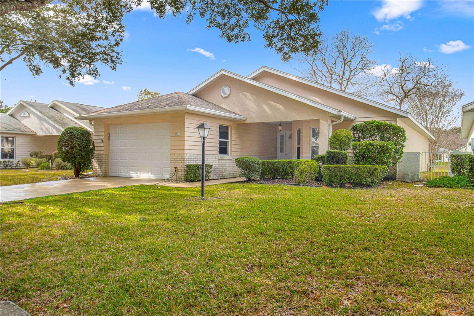 Rare Radiant Relaxed
Imagine stepping into your new life in this Madison Model home, located in the vibrant 55+ community of On Top of the World (OTOW) in Ocala, FL. As a new buyer, envision yourself living your dream retirement in this beautiful setting, surrounded by the allure of Central Florida.
As you enter your 2-bedroom, 2-bathroom home, you're greeted by the spacious great room, where vaulted ceilings and abundant natural light create an inviting atmosphere. This is your new haven for relaxation, whether you're reading your favorite book or enjoying a quiet afternoon. The integrated lanai extends your living space, offering a serene spot to sip your morning coffee while gazing at the stunning views of the Tortoise and Hare Golf Course.
Your eat-in kitchen, with ample counter space and a practical pantry, is the heart of your home. Here, you'll prepare healthy meals or entertain friends and family, savoring the joys of culinary creativity. The adjacent laundry room adds convenience to your daily life.
The master suite is your private retreat, with a double walk-in closet and a pampering make-up area. The ensuite bathroom, designed with safety in mind, features double vanities and a walk-in shower. The guest bedroom, with its large walk-in closet, is perfect for when friends and family come to visit, ensuring their comfort and privacy.
Living in OTOW is about embracing an active and luxurious lifestyle. The community offers a plethora of amenities – from golf courses and fitness centers to tennis courts. The 24-hour security provides peace of mind, and with exterior maintenance taken care of, you have more time to indulge in your passions.
Envision your days filled with activities and leisure. Whether it's exploring Ocala, known as the horse capital of the world, or taking short trips to nearby Orlando, Tampa, and Daytona, you're never far from adventure. The allure of both East and West Coast beaches is just a drive away, offering endless opportunities for seaside excursions.
Ocala's central location means you're never far from exquisite dining options, recreation, and shopping. The availability of quality healthcare nearby adds to the convenience and security of your new life.
This home is more than just a place to live; it's a gateway to a retirement filled with luxury, comfort, and adventure in the heart of Central Florida. Welcome to your new life at OTOW, where every day is a new opportunity to live your retirement dream to the fullest.
Don’t delay. Look at the photos. Read the description. Then ask yourself ‘ why is such a desirable property priced so insanely low? Give me a call and I’ll let you know..