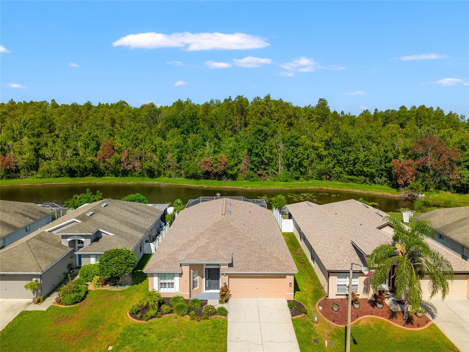 Relax by the pool and take in the serene view—if you’re lucky, you might even spot deer running through the
woods beyond the pond. This beautifully updated home is located in the gated Marchmont Village of Oakstead
and offers a perfect blend of comfort and nature. As you enter, you’re welcomed by formal living and dining
rooms to your left, ideal for entertaining. The open-concept kitchen and family room are the heart of the home.
The kitchen features stainless steel appliances, granite countertops, and a spacious island that overlooks the
family room—with stunning views of the pool and peaceful pond beyond. Additional highlights include wood
laminate and ceramic tile flooring throughout—no carpet! The roof will be replaced prior to closing, and the
brand new HVAC system was installed in March 2024.
Enjoy the many amenities Oakstead has to offer: a resort-style pool, splash pad, fitness center, tennis and
basketball courts, playground with a low $70 HOA yearly fee.