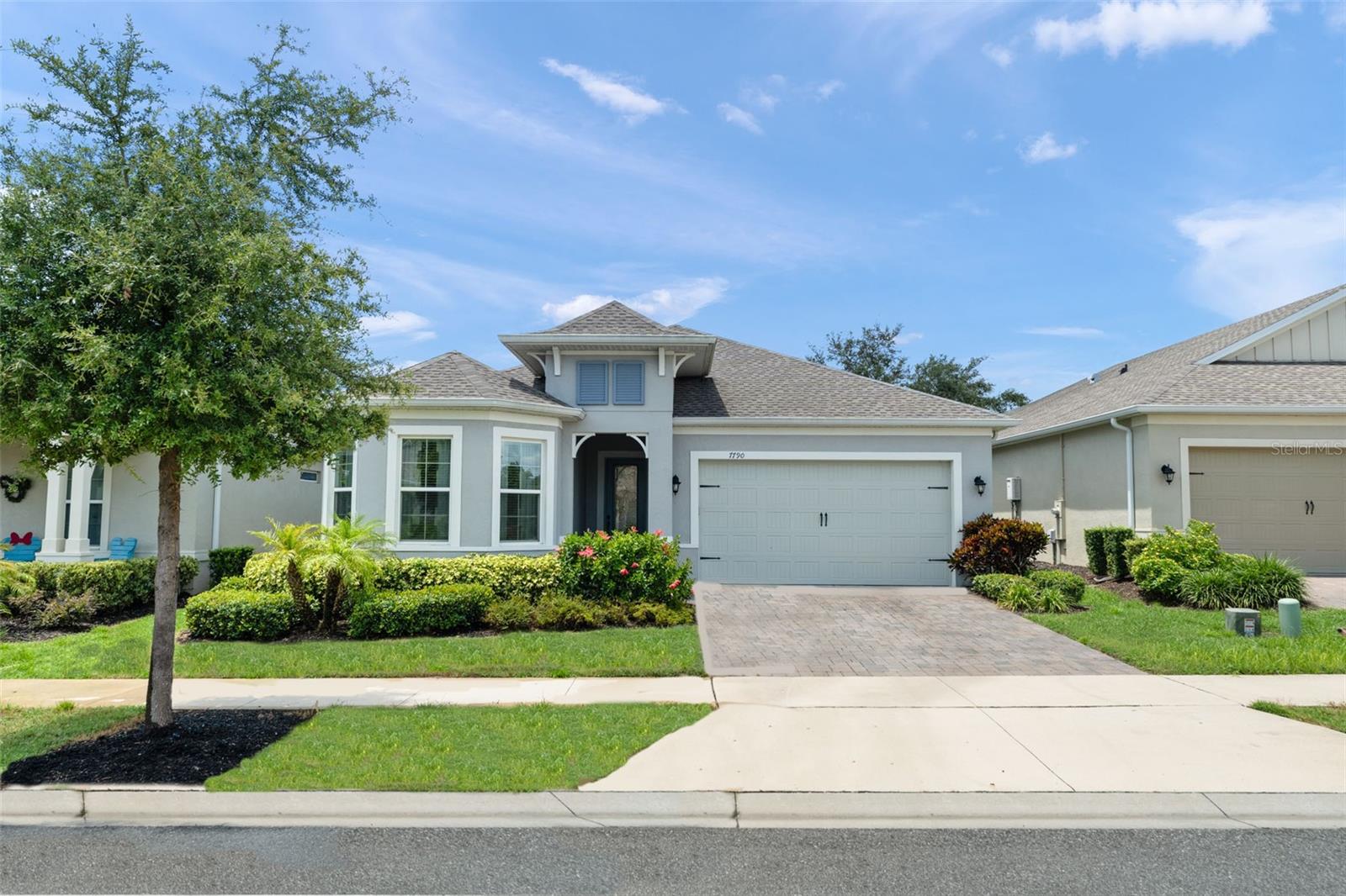 Refined casual elegance defines this picture-perfect better than new golf course-frontage retreat with sparkling private pool with screen enclosure, positioned mid-fairway on the 2nd hole of the Mystic Dunes Golf Course, inside the guarded gates of the 55-plus Four Seasons at Orlando resort community. This Dominica model stands supreme for its highly desirable floorplan with 3 bedrooms, windowed office (optional 4th bedroom), primary retreat, added windows throughout to maximize natural lighting, plus gourmet kitchen with gas cooktop, mammoth island with sink, double ovens, and custom cabinetry. The owner’s suite offers a sanctuary of its own with bright windows, pool entry door, tray ceiling, double vanities, and walk in glass-framed shower with multiple-headed jets and rock flooring. Corner glass sliders reveal a private outdoor oasis with conversation area, sparkling salt water pool with heater, shear waterfall and bubblers, two fire urns, and cool-deck patio for year-round enjoyment. Enjoy unobstructed views of the golf course and no rear neighbors. Four Seasons is a 55+ resort-style community offering 24-hour guarded gated access, a 13,000 square foot clubhouse, two in-ground pools, hot tub, and fitness center, plus tennis, pickleball, and bocce ball courts. Enjoy the carefree lifestyle as all exterior landscaping is included in the HOA fees. Located just minutes from Walt Disney World® and all of Central Florida’s famed attractions.