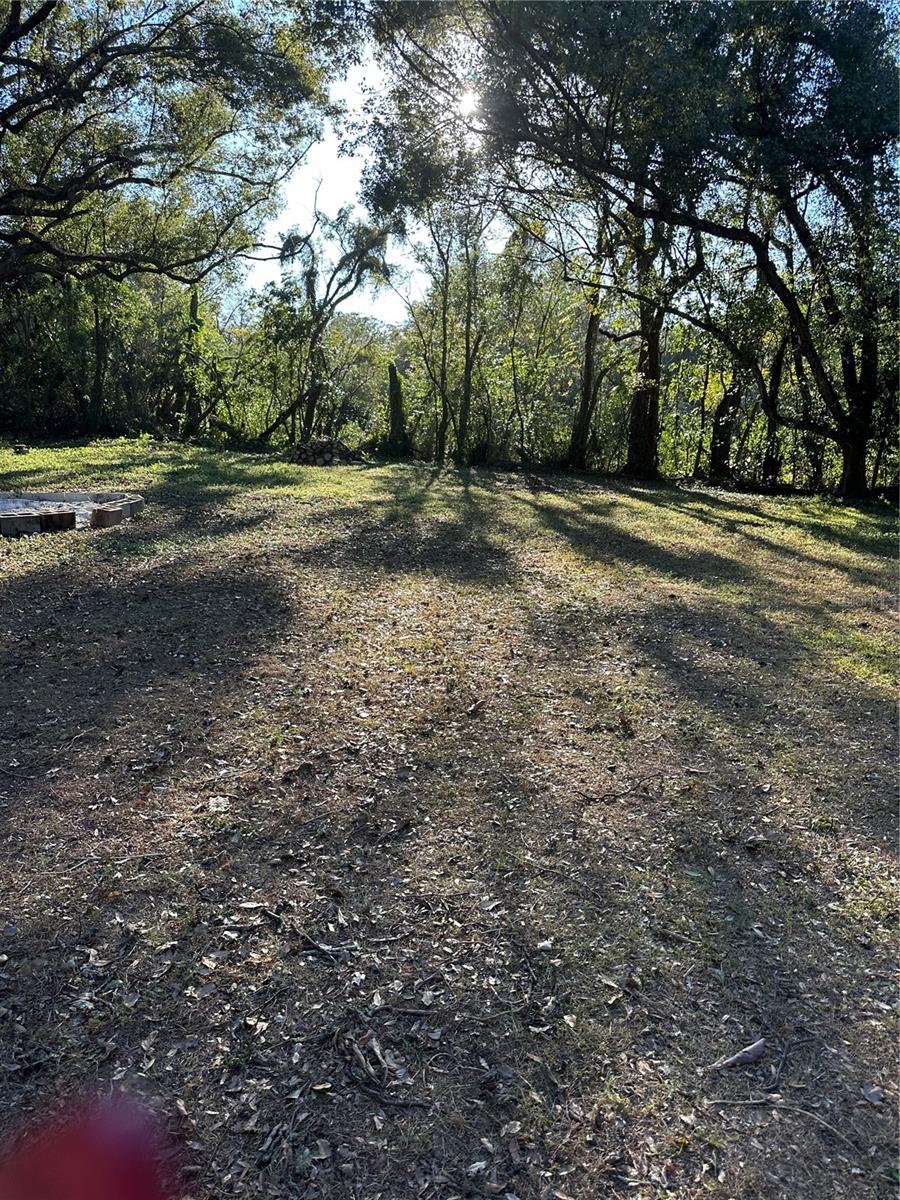 "Beautiful acreage, partially cleared and ready for your dreams! Utilities are already on-site, and the property is fully fenced. Enjoy the best of both worlds: privacy and tranquility while conveniently close to commerce. A serene and functional space waiting for its next owner!"A MUST SEE!