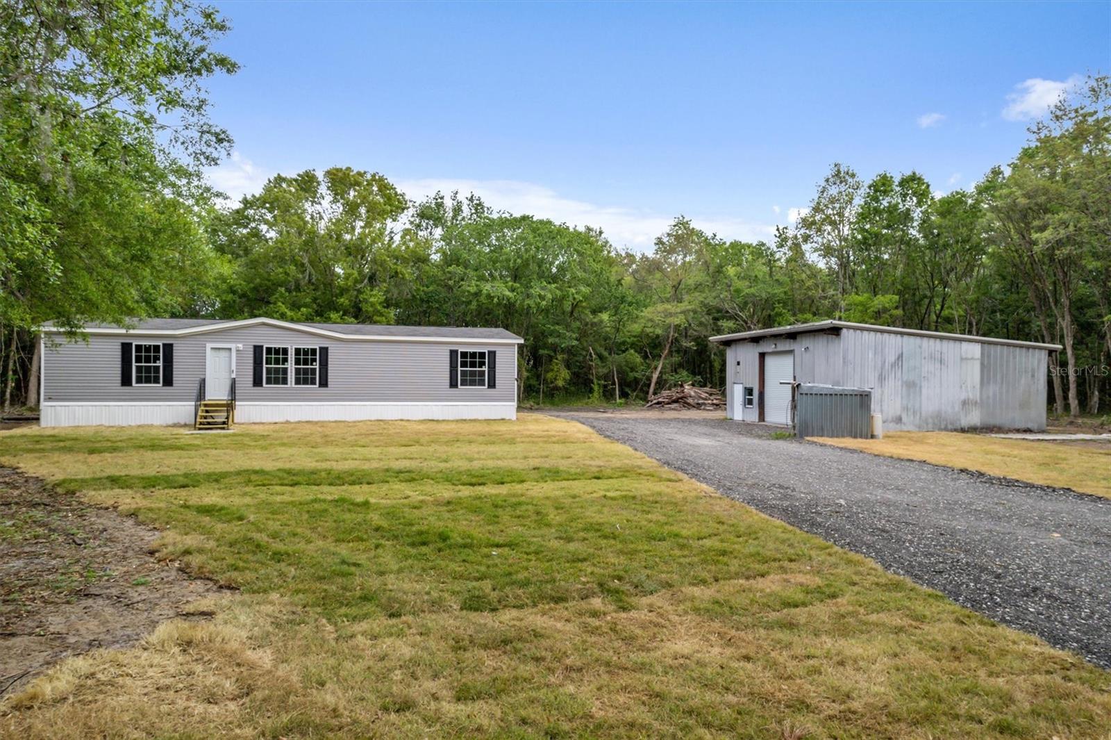 Country living with city convenience! This brand-new doublewide manufactured home sits on 1.13 acres, offering nearly 1,500 sq. ft. of living space with 3 bedrooms and 2 baths. The property features a mechanical garage with a bonus room, a shed for extra storage, and plenty of space for all your toys.
Located about 20 minutes from Palm Coast and St. Augustine, and only 20 minutes to the beach, this home is perfect for those who love the outdoors. No HOA—bring your ATVs, boats, and RVs! Enjoy nearby trails, mudding spots, and the freedom of open space while staying close to shopping, dining, and entertainment. Don’t miss this unique opportunity!