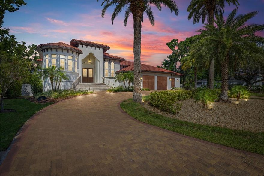 Welcome to this exquisite, modern waterfront residence in the heart of Sunset Park. Built in 2016, this luxurious custom 4,665 sqft home combines intricate design, high-end finishes, and unparalleled Florida outdoor space. Situated on an oversized, half acre lot (0.53), this stunning home has been meticulously thought out and pride of ownership is very evident from the wrap around driveway to the boat lift and floating kayak dock. With 4 spacious bedrooms, 4.5 bathrooms, and a dedicated office space that can be flexed to a 5th bedroom, this home is perfect for both relaxation and productivity. The open-concept layout is ideal for entertaining, featuring a gourmet kitchen with premium appliances, a large island, custom cabinetry, and granite countertops, formal dining room, and a bright living area that seamlessly flows out to your private outdoor oasis.  Rich hardwood floors and custom wood trim are throughout. Step outside to your outdoor kitchen and saltwater pool, where you can enjoy breathtaking views of the water and picturesque sunsets. The expansive lanai offers plenty of space for dining and lounging, making it perfect for outdoor gatherings. Additional highlights include a luxurious master suite with a spa-like bathroom, 3-car garage and ample storage throughout. This home offers the best of South Tampa living – modern luxury, waterfront serenity, and an unbeatable location within the highly sought after Plant High School District. Schedule your private showing today and experience all that this stunning home has to provide! Ask for the unbranded Matterport virtual tour!