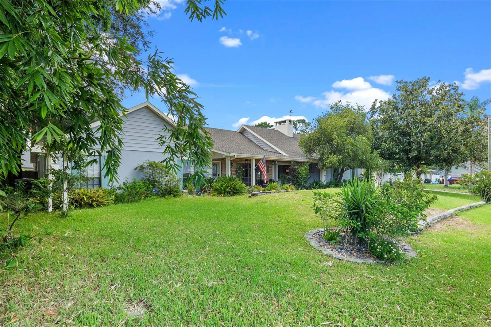 Welcome home to this beautifully updated 3-bedroom, 3-bathroom ranch-style retreat offering 2,207 square feet of living space on just over a quarter acre of land in Eustis! Nestled on a quiet street with no HOA, this property combines the best of country tranquility while providing proximity to everyday conveniences and the charm of nearby Mount Dora, Tavares, and Umatilla.
As you step through the front entrance, you’re greeted by an open floorplan with airy vaulted ceilings and wooden beams, an abundance of natural light provided by large floor to ceiling windows, and French doors that draw your eyes straight to the screened-in pool area, creating a seamless indoor-outdoor living experience. To your right, an inviting great room is centered around the cozy stone-faced, wood burning fireplace alongside sliding glass doors that lead you back to your large covered front porch.
Just off of the great room you will find two dining areas, each with direct access to the pool deck and the completely renovated kitchen, a true chef’s delight featuring granite countertops, a high-end gas range and oven, solid wood cabinets as well as a pass through to the dinette area, perfect for your entertaining needs.
Step through the French doors to your own private oasis: a large screened-in pool deck with a refreshing swimming pool, covered lounging area with ceiling fan, and plenty of deck space to relax or entertain. Whether you're hosting guests or enjoying a quiet morning swim, this area is truly the heart of the home.
After enjoying the pool, imagine sitting out front on the massive covered front porch. Another standout feature, with its stone veneer, tongue and groove ceilings, multiple ceiling fans, and peaceful views of the 770-acre Pine Meadows Conservation Area across the road. It’s a perfect place to unwind at sunset, enjoy a good book, or sip your morning coffee with nature as your backdrop.
Back inside, the left wing of the home features three spacious bedrooms all offering luxury vinyl flooring. The primary suite is privately situated at the rear of the home with direct access to the pool deck via a beautifully renovated ensuite bathroom. Just off the primary bedroom is a flexible guest bedroom that also works great as a home office. The third bedroom is generously sized and located near a full hall bathroom boasting double a vanity, perfect for guests or family members.
On the opposite wing of the home is a third full bathroom, conveniently located just off the family room, leading to the oversized laundry room, which includes a utility sink, private entry/exit and plenty of cabinetry for additional storage.
Outside, you'll appreciate the 2-car garage and extended driveway offering plenty of parking. The fully fenced backyard includes a large shed for storage, and the mature landscaping adds to the charm and privacy of the home.
This home is the perfect blend of modern comfort and country charm with no HOA to limit your lifestyle. Don’t miss your chance to call this Eustis gem your own and schedule your private tour today!