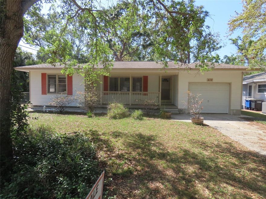 One or more photo(s) has been virtually staged. Discover timeless character and classic Florida charm at 412 N. Jefferson Avenue in Clearwater, a 2-bedroom, 2-bath home originally built in 1954 and filled with distinctive architectural details rarely found today. Warm wood flooring, thoughtful built-in features, and an abundance of natural light create a welcoming interior that feels both inviting and full of personality. The spacious living room offers generous room for gathering and everyday living, while vintage design touches—including the charming built-in telephone niche, a nostalgic feature common in mid-century homes—add authenticity and a sense of history that reflects the era in which the home was built.

The property offers wonderful indoor and outdoor living possibilities. The backyard is truly a standout feature, offering a large and beautifully shaded setting enhanced by mature landscaping that creates a sense of privacy and established natural beauty. A rear deck with a hot tub provides a relaxing place to unwind and overlook the yard, while the generous lot still offers ample space for future enhancements such as a pool, expanded entertaining areas, lush gardens, or additional outdoor living spaces. Whether you envision a peaceful garden retreat or a lively space for gatherings, the backyard offers the flexibility to bring those ideas to life. The garage includes a utility area and an additional bathroom, adding practical functionality and flexible use for hobbies, projects, or workspace needs.

Situated in Clearwater, the home provides convenient access to many of the area’s well-known destinations and amenities. Clearwater Beach is approximately 5 miles away, offering award-winning Gulf beaches, waterfront dining, and recreation. Downtown Clearwater and Coachman Park are approximately 2 miles away, providing concerts, waterfront activities, and community events along the Intracoastal Waterway. Shopping, dining, and everyday conveniences along Gulf to Bay Boulevard are roughly 1 mile from the property, while U.S. Highway 19 is approximately 2 miles away, providing convenient access throughout Pinellas County. Downtown Dunedin is approximately 6 miles away, known for its charming waterfront district, restaurants, and access to the Pinellas Trail. Tampa International Airport and downtown Tampa are approximately 20–22 miles away, making regional travel and commuting accessible.

With its blend of Old Florida charm, natural light, character-rich details, and a spacious yard framed by mature landscaping, this home offers a unique opportunity to enjoy the warmth and personality of a mid-century residence while creating your own vision for the future.
All information provided is believed to be accurate but is not guaranteed. Buyers and their agents are responsible for verifying all facts, measurements, and information deemed important to their purchase decision.