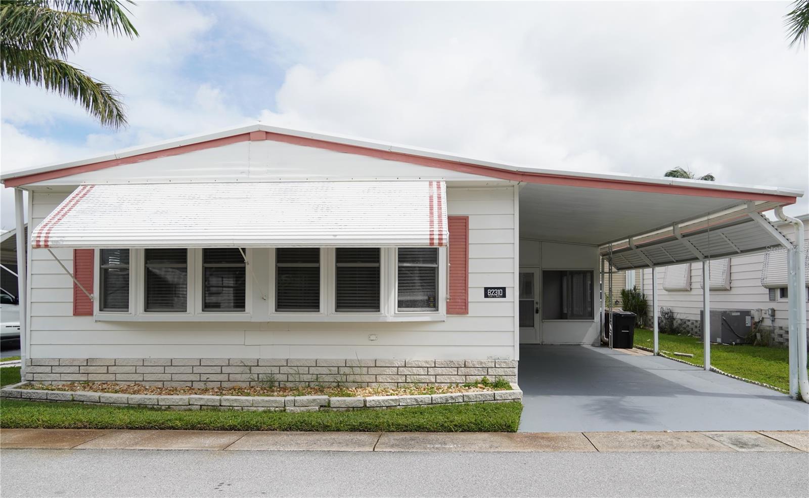 Wonderful Resident Owned 55+ Community, Monthly HOA is only $210 and that includes water, sewer, trash and lawn care. Pet friendly under 20 lbs. This is a very wonderful 1219 sq ft., 2 Bedroom, 2 Bathroom home that features a water purification system for the entire home as well as a reverse osmosis system for the kitchen. Recently painted the home has been updated with a surge protecter in the electrical panel. The floors have been done with laminate throughout the living area and dining area. All the subfloors are solid. The kitchen has been completely remodeled and features newer cabinets and counters as well as new hutch in the dining area. The bay windows have been updated in the front of the home. The guest bathroom has been remodeled, and features grab bars and a foldout seat in the walk-in shower. The home has a roof-over and also features French drains for the gutter system. The previous owner has installed a concrete slab for a BBQ. The shed has been updated with newer wiring for the washer and dryer. Located in Golden Gate Mobile Home Park this is a 55+, resident owned community with a lot of amenities. The park features a clubhouse, outdoor covered shuffleboard courts, pool, jacuzzi horseshoes, and patio area outside the clubhouse. The clubhouse has a library book exchange and billiard room also. A very active community perfect for retirement! Located right next door to a Walmart Super Center, lots of restaurants and minutes from the beach.