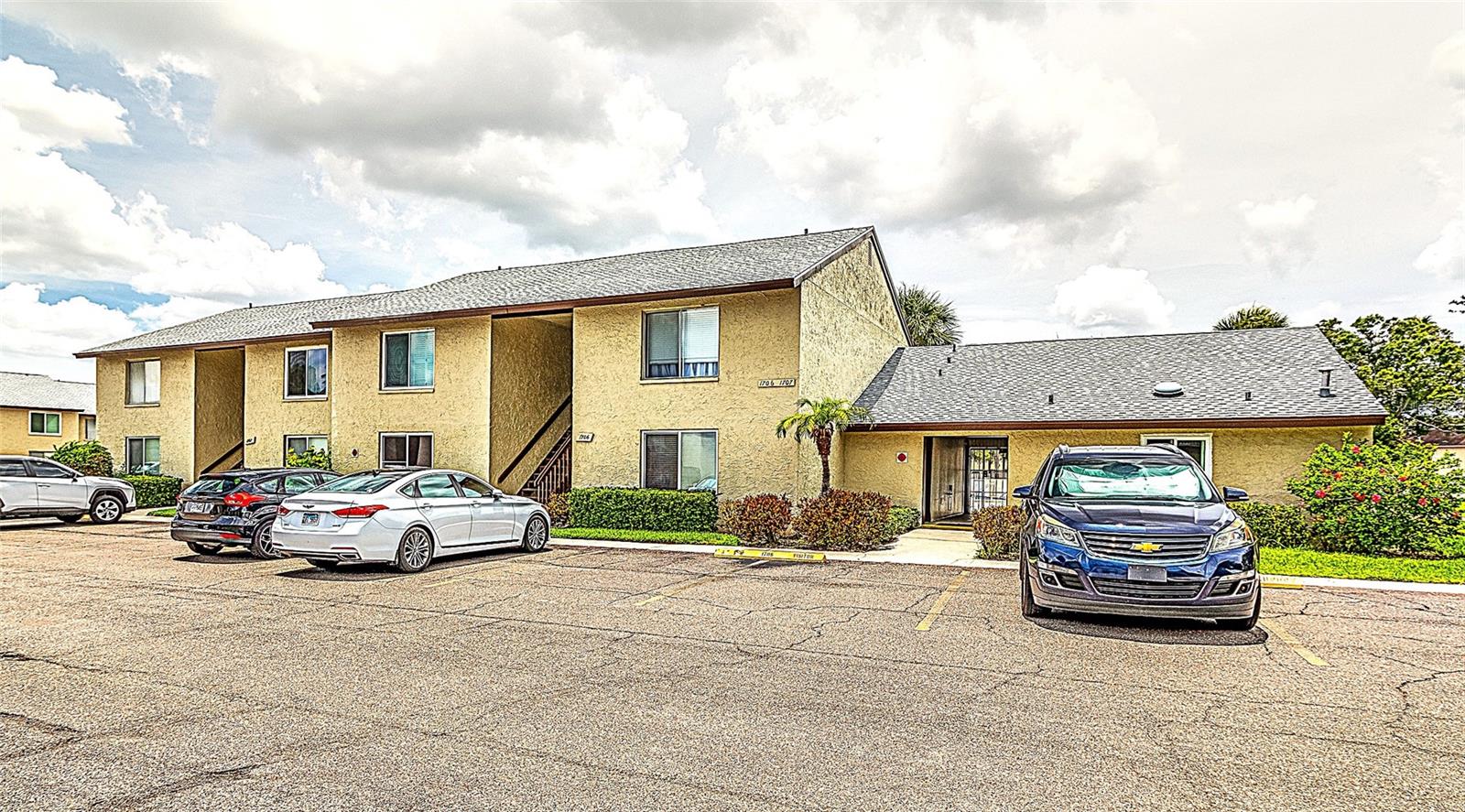 LOCATION, LOCATION, LOCATION! - Easy access ground floor unit is situated just 29 steps from the laundry room and Swimming pool area. You simply cannot find a more convenient unit at WOODSIDE VILLAGE. This is a significant benefit, assuming that you don't want to "work out" every time you do laundry. For those that still insist on daily exercise, mega-gyms AMPED FITNESS & ESPORTA FITNESS are less than 1/2 mile away. The unit features a Warm & Rich color scheme complimented by neutrally designed Ceramic Tile throughout. Floor to ceiling tiles adorn the bathroom. There is a spacious Walk-In Hall closet that can flex as a Perfect Pantry or Storage room. FULL WALL of clothing closets in bedroom. Convenient parking space for you reserved directly outside unit with more than ample guest parking available. WOODSIDE VILLAGE offers remarkable affordability alongside 3 heated & pristine swimming pools. Big Clubhouse with fully equipped kitchen, pool table, fireplace, library, sauna and shuffleboard courts. WOODSIDE VILLAGE is a peaceful, established & laid-back Community that welcomes residents of all ages. The low HOA Contribution ($565/month) covers Water, sewer, trash, landscaping, security, roof repair & replacement & on-site management. Situated in an amazingly convenient Central Pinellas County Location, WOODSIDE VILLAGE offers exceptional convenience to a countless variety of businesses, shopping, and dining options. Very close-by amenities include a Walmart Supercenter, 2 Publix Supermarkets & a Winn-Dixie Market. Walgreens and CVS Pharmacies, Applebee's & Chili's, Outback Steakhouse, Whiskey & Wings, Starbucks & too many others to mention. St Petersburg-Clearwater Intl Airport is only 4 miles away. Best of all, both World-famous Clearwater Beach & Indian Rocks Beach are a quick 25-minute drive. Unit can be leased after 1-year of ownership for 30-day minimum. There is no MILESTONE INSPECTION required for this complex as it is less than 3 stories tall.