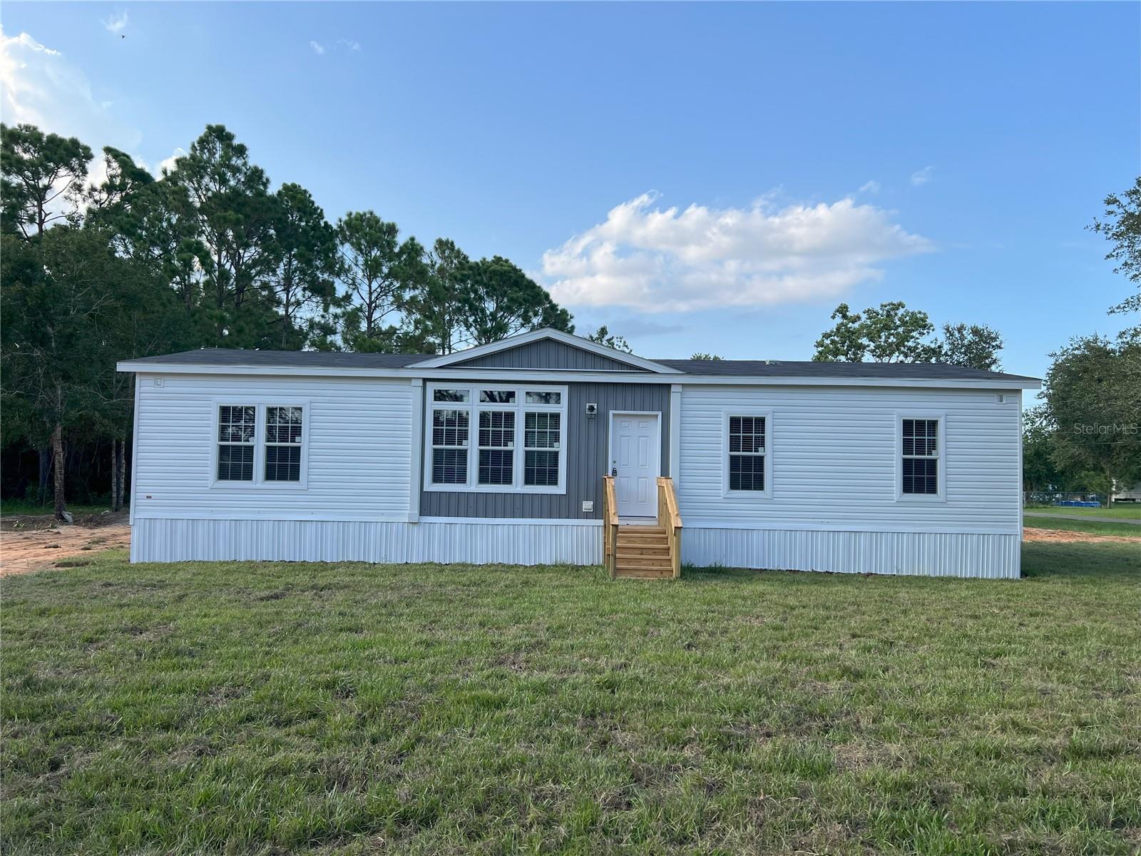 New home with manufacturer's warranty and move in ready, Open floor plan split plan with bonus room. All new appliances, well and Septic system to be installed prior to closing.