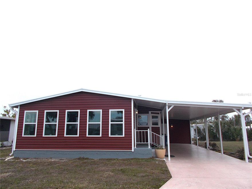 This may be a 1983 mobile, but just about EVERYTHING is BRAND SPANKING NEW!!!!  This 2 bedroom, 2 bath mobile in Sandalwood Park offers over 1,000 square feet of living area PLUS a brand new 19x9 Florida room with 7 real windows!!  Talk about letting the beautiful Florida sunshine in!!  You will find a brand new kitchen, complete with stainless appliances (including a dishwasher), new vinyl flooring throughout, new electrical panel, new primary ensuite bathroom, new vanity in the guest bathroom, freshly painted inside, generous room sizes AND inside laundry!  Outside you'll enjoy a new roof with a transferrable warranty, new carport, new vinyl siding and a brand new shed.  Sandalwood Park offers a heated & cooled pool, tons of activities & gatherings, a dog park and the location is superb!  You're close to shopping, medical offices, restaurants and just about everything you need!  Don't miss out on this fantastic opportunity in one of Venice's most sought after parks.  Make your appointment today and make this mobile yours. . . . . before someone else does!