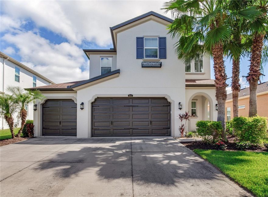 Immaculate Pool Home with Designer Upgrades and Timeless Finishes! Welcome to this beautifully maintained and upgraded residence nestled in the highly desirable Estancia community. This stunning two-story home offers an inviting open-concept layout designed for modern living and effortless entertaining. The updated kitchen is the heart of the home—featuring a custom extended island with new quartz countertops, a designer tile backsplash, stainless steel appliances, double ovens, and abundant cabinetry for storage. The kitchen flows seamlessly into the spacious living and dining areas, filled with natural light and elegant details such as crown moulding throughout, neutral tile flooring, and designer lighting.  Upstairs, you’ll find generously sized bedrooms including a luxurious primary suite with a large sitting area, tray ceiling, and a spa-inspired bath with dual vanities and a walk-in shower.  Step outside to your private Florida oasis! Enjoy a screened-in pool with stacked-stone water features, a sun shelf, and a new SunSetter powered awning (2025) for added shade and comfort. Relax in the above-ground spa under a covered pergola or entertain guests in the outdoor kitchen area. The yard is partially fenced (two of three sides) for privacy while maintaining an open, airy feel.  Additional highlights include a three-car garage, freshly repainted exterior (April 2025), upgraded fixtures throughout, and energy-efficient features.  Located near top-rated schools, shopping, dining, and major highways—this home blends style, comfort, and convenience in one perfect package