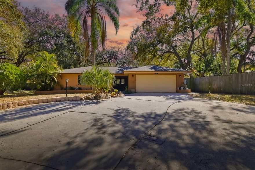 Come see this updated 3 bedroom 2.5 bath POOL home on 1/3 acre lot, with a privacy fence, and sits away from all the busy roads on a cul-de-sac lot which makes this a quiet and private oasis. The inside was remodeled in 2016, new flooring and painting in 2024. Enter the open chef-kitchen with dark espresso cabinets, granite countertops with new stainless steel appliances, under cabinet lighting, and a dry bar with a wine refrigerator. All the bathrooms are updated. Ceramic tile flooring throughout wet areas. NO CARPET! New porcelain wood like tile and 5 1/4 inch baseboards with Behr paint throughout the living area. All the bedrooms have walk-in closets. Added recessed lighting in the living room and kitchen area, on dimmers. New ceiling fans throughput home with 4 out of 5 having remotes (Jan 2024). New black door hinges were replaced throughout (Jan 2024) and 4 doors with built-in blinds. Central A/C, water heater, and impact resistant windows (windows and doors replaced in 2016). Fresh Behr paint throughout INTERIOR of the home; Jan 2024. Fresh Valspar paint EXTERIOR of the home; 2022. The roof was replaced in 2017. Hurricane plywood panels pre-drilled and labeled for all windows and doors except the front window. Screened in pool, added a fire pit with stacked firewood, and a HUGE backyard. NO HOA OR CDD! NO deed restrictions! SO BRING YOUR RV, BOAT, OR ANY OTHER TOYS! A HUGE EXTENDED DRIVEWAY! This gorgeous home is move-in ready and just waiting for its new owner and enjoy all it has to offer! Located in a highly desirable, quiet, manicured, subdivision of Sunshine Estates close to downtown Tarpon Springs, Golfing, Beaches, Lake Tarpon and Shopping. TOP RATED SCHOOLS, ALL TESTING ABOVE AVERAGE!! The zoned high school: Palm Harbor University High School ALSO a MAGNET SCHOOL!! Don't Wait.. Schedule your showing today!!