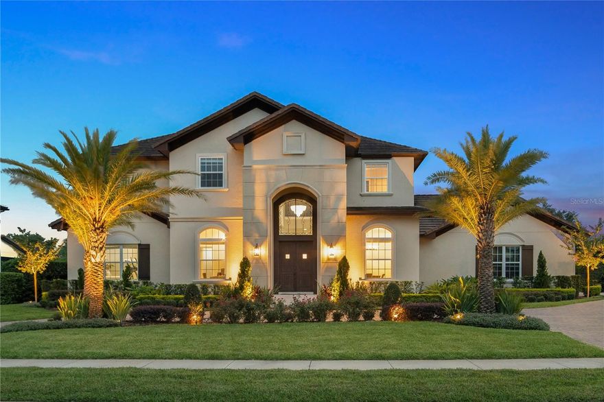 Under contract-accepting backup offers.One or more photo(s) has been virtually staged.  Unparalleled luxury living in this exceptional 5 bedroom, 6 bath home with almost 5,000 sq.ft. of stylish living space that is sure to impress those in search of timeless elegance and ultimate privacy. This sprawling two-story residence sits on over a 3/4 acre lot with front facing water views in the highly sought after guard-gated Bellaria community with only 64 estate homes. This home is in pristine condition and has been cared for meticulously by the current owners who have made numerous custom transitional updates throughout. Upon arrival you are greeted by an impeccably landscaped front yard with circular driveway leading to the oversized 3-car garage. Once you step inside you are captivated by the abundance of natural light and modern great room, open-concept living.  This seamless floor plan has endless possibilities boasting wide plank wood tile, separate formal living and dining areas that can easily be used as a private study as the current owners do or even a 6th bedroom en-suite. The gourmet kitchen features custom cabinetry, a generous island with seating, adjacent butler's pantry, Thermador stainless steel appliances, and an oversized walk-in pantry. From the kitchen to the great room you can enjoy the elegance that extends beyond its interior with gorgeous views of the wall to wall windows and French doors unveiling the stunning backyard with plenty of room for a pickleball or sports court. The downstairs primary suite provides a private getaway with spa-like bathroom, and the upstairs 2nd primary suite, which would also make a perfect bonus room or home theater includes a private balcony to enjoy the beauty of the impeccable grounds, two large walk-in custom closets, and a convenient morning kitchen. Three additional en-suite bedrooms are also upstairs as well as a loft area with plenty of room for cozy lounging. The gorgeous backyard features a recently resurfaced resort style pool with newly added spa, deck tile, fire bowls, ultra-lush landscaping, outdoor seating and a built-in summer kitchen. Newly added home automation system (2019), new A/C system (2022), and landscape lighting (2020) join the host of upgrades. Bellaria is an intimate upscale community with a 24-hour staffed gatehouse nestled in the exclusive community of Windermere. Enjoy the convenience of being just minutes from Winter Garden Village, downtown Winter Garden, A+ schools, upscale shopping, fine dining, top area attractions, as well as easy access to major roadways and Orlando International Airport.