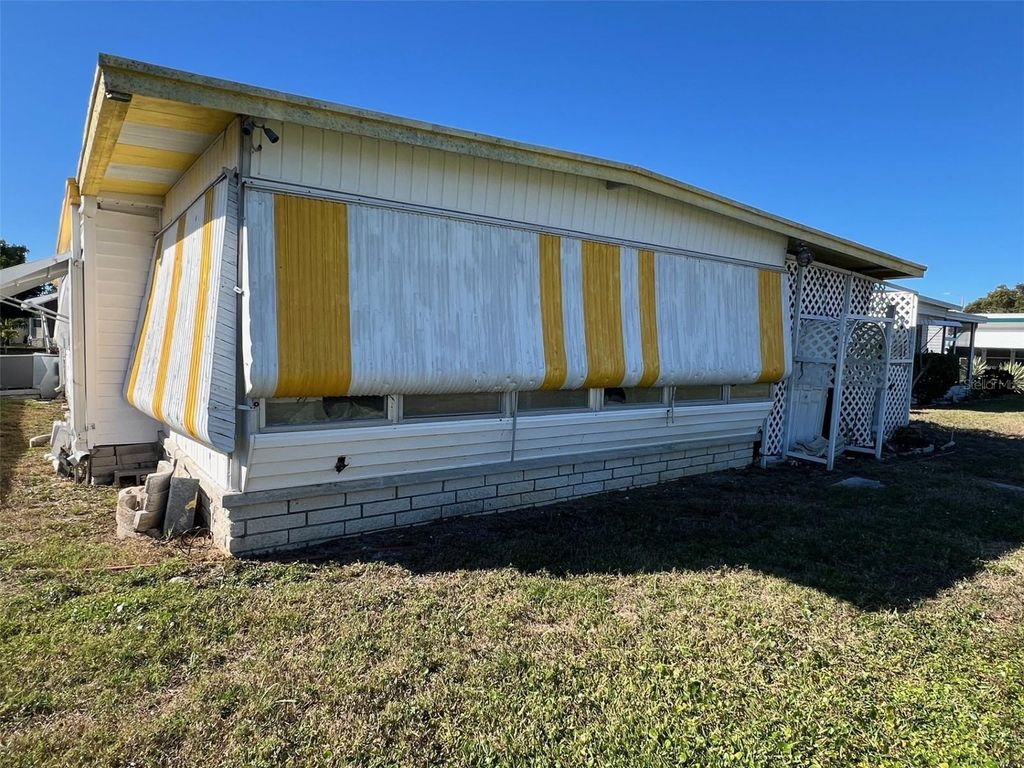 Photo of 61 Thatch Palm Street W, Largo, FL 33770 (MLS # TB8464821)