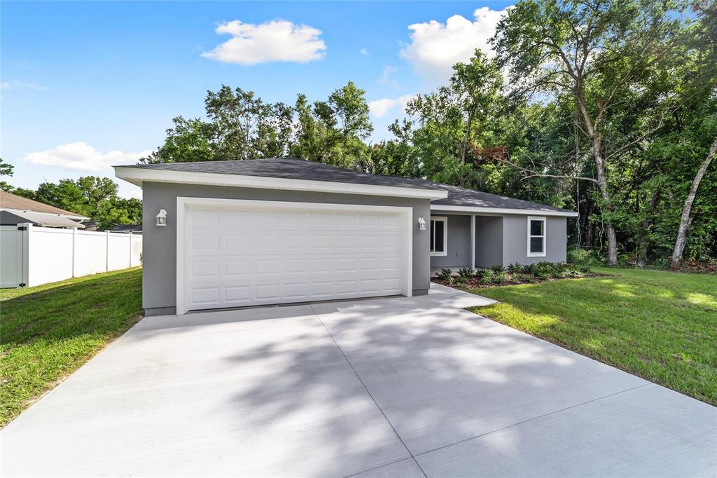 Photo of 25 Malauka Loop Place, Ocklawaha, FL 32179 (MLS # O6361678)