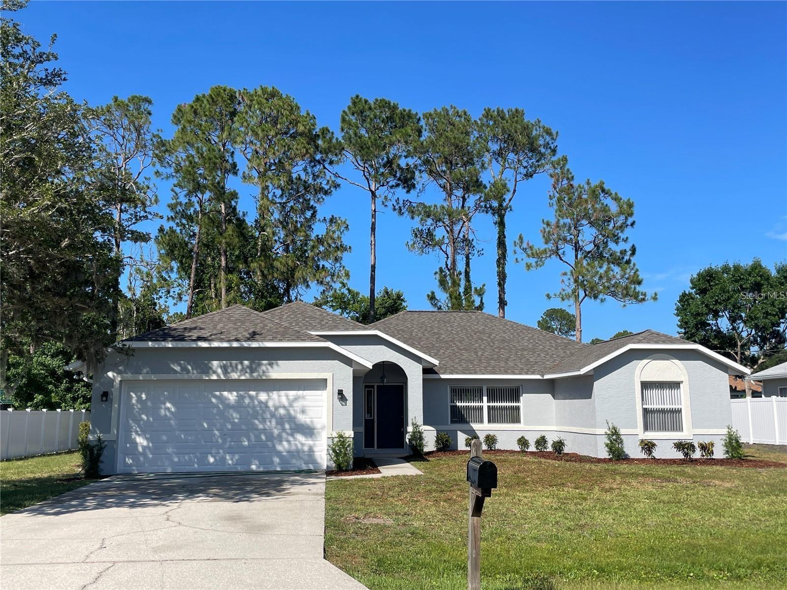 This 3/2/2 home is located in a great neighborhood in sought after Indian Trails subdivision of Palm Coast...Large upgraded kitchen plenty of cabinet space and all new efficiency appliances. *Special featured family room with a fireplace* -Beautifully tiled floors throughout and new carpet in all bedrooms. The custom built screened-in pool cage and lanai overlooking the pool will make for that perfect outdoor afternoon picnic while watching the kids swimming around and having fun. This home is located close to prestigious schools and just minutes to the beach.