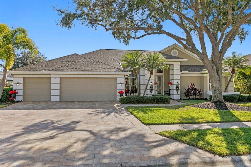 Located in the northwest Tampa suburb of Odessa, this beautifully updated light and bright home is nestled within The Eagles, a guarded, gated golf community known for its privacy, natural beauty, and resort-style living—one of Hillsborough County’s most desirable neighborhoods.  Residents of The Eagles enjoy the convenience of manned security gates at both entrances, access to two championship 18-hole golf courses—The Lakes and The Forest, and an active lifestyle supported by a clubhouse with a full-service restaurant and pro shop, scenic walking trails, lakes, and a community park. With a low HOA, a pet-friendly atmosphere, and abundant wildlife, the community offers a rare blend of luxury and tranquility. This pride-of-ownership, move-in-ready home has been thoughtfully and extensively upgraded. Some of the improvements include pavered driveway, walkway, and patio, a remodeled kitchen and laundry room, newer interior and exterior paint, PebbleTec pool surface, lush landscaping, and recent mechanical updates such as a newer roof (2024), waterheater, and water softener. Inside, the open floor plan is enhanced by high ceilings, elegant crown molding, and 5¼-inch baseboards throughout most of the home. Hard-surface flooring flows throughout, featuring 36" marble-look porcelain tile in the main living areas and luxury vinyl plank flooring in three bedrooms and the hallway. Additional interior highlights include etched-glass double front doors, plantation shutters, a motorized/battery-operated shade in the family room, and updated ceiling fans in select bedrooms and on the lanai. The fourth ensuite bedroom is currently configured as a custom home office, complete with built-in bookcase, desk, and wood cabinetry—ideal for remote work, a guest suite, or multigenerational living. Original porcelain tile has been preserved, should a future owner wish to easily convert the space back to a traditional bedroom. Outdoor living truly shines, with three of the four sets of sliding glass doors featuring triple-pocketing panels, seamlessly opening the home to a private screened lanai overlooking a tranquil pond. The PebbleTec pool with waterfall and spa creates a true Florida outdoor retreat—perfect for entertaining or unwinding year-round. The pool bath vanity and sink have also been updated for added convenience.An oversized three-car garage provides ample storage, featuring extensive cabinetry and select tools that will convey. Ideally located just 25 minutes from Tampa International Airport, close to Citrus Park and Countryside Malls, grocery stores, medical facilities, and highly rated schools, with Tampa Bay and Gulf beaches only 30–40 minutes away, this home delivers the perfect balance of location, lifestyle, and livability. An exceptional opportunity to enjoy refined golf-community living in The Eagles—where comfort, privacy, and Florida living come together beautifully.