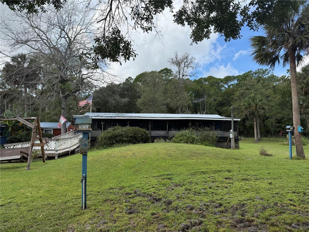 Photo of 1844 Papaya Street, Bunnell, FL 32110 (MLS # FC321694)