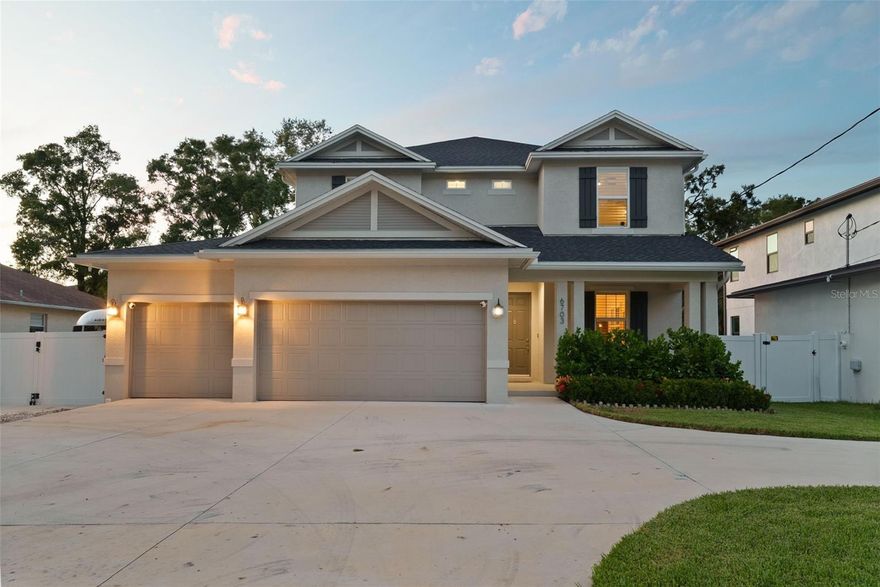 Welcome to this impeccably built 2023 POOL home, perfectly situated on an oversized lot in a no-flood zone in the heart of South Tampa. Designed with modern luxury, energy efficiency, and everyday comfort in mind, this spacious residence truly stands out.

Step inside to an open and inviting floor plan featuring 4 bedrooms, 3 full bathrooms, and a versatile bonus loft. The first-floor bedroom and bath are ideal for guests or multi-generational living. The gourmet kitchen is a chef’s dream with stone countertops, a stainless farmhouse sink, high-end appliances, and oversized pantry. The open-concept great room provides flexible space for dining, entertaining, or a home office, while the adjacent family room creates a cozy space for everyday living.

Outside, enjoy your private backyard oasis with a covered lanai, beautifully designed pool, and large fenced yard—perfect for relaxing or entertaining. A full working shed adds extra utility, and there’s additional parking for a boat or RV.

Upstairs, the primary suite offers a spacious retreat with a spa-like bath featuring a soaking tub, walk-in shower, and large custom closet. Two guest bedrooms share a stylish full bath, and the laundry room includes high-end washer and dryer for added convenience.

Additional highlights include hardwood floors, plantation shutters, impact windows, and a 3-car garage with ample storage. Located just minutes from South Tampa’s favorite destinations—Westshore Marina District, Hula Bay, Cru Cellars—and offering easy access to Downtown Tampa and St. Petersburg, this home offers the perfect blend of luxury and lifestyle.