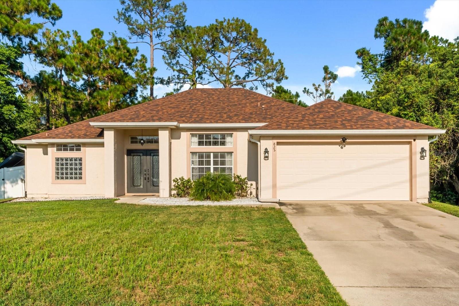 Welcome to this beautifully maintained 4-bedroom, 2-bathroom home nestled in a quiet neighborhood of Deltona, Florida. With 2,124 square feet of thoughtfully designed living space, this residence offers the perfect blend of comfort and functionality. The open-concept layout creates a spacious, airy feel that’s ideal for both everyday living and entertaining guests. The split floor plan provides added privacy, with the primary suite set apart from the additional bedrooms — perfect for families or guests.
Step inside to find a light-filled interior featuring a generous living area that flows seamlessly into the dining space and kitchen. The kitchen boasts ample cabinetry and counter space, ideal for preparing meals while staying connected with family and friends. From the living area, step out onto the screened-in rear patio — a peaceful retreat with no rear neighbors, offering privacy and tranquility for morning coffee or evening relaxation.
Additional highlights include a 2-car garage and a prime location just 30 minutes from both the world-famous beaches of the Atlantic coast and the vibrant culture of downtown Orlando. Whether you're looking for a serene place to call home or a central location close to everything Florida has to offer, this home is the perfect fit. Don’t miss your chance to own a slice of comfort and convenience in one of Deltona’s most desirable areas!