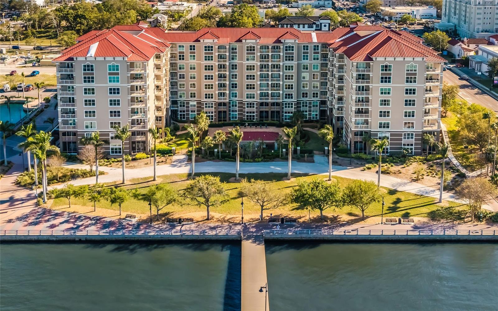 Experience waterfront living at River Dance, a premier condominium community along the Manatee River in the heart of Bradenton’s Riverwalk. This turnkey-furnished, two-bedroom, two-bath residence offers a cheerful blend of comfort and convenience, featuring an in-unit laundry room, elegant wood cabinetry with granite countertops and ceiling fans throughout for optimal comfort. Unwind on the screened-in balcony, where panoramic views of the pool and Manatee River create a serene retreat. This residence also includes two designated garage spaces, providing secure parking in this sought-after community. River Dance offers an array of resort-style amenities, including a social room, business center, exercise room and private movie theater. Entertain visitors effortlessly with access to on-site guest rental suites. Outdoor amenities include pool, spa, patio with grilling area, jogging path, six-hole putting green and sports deck complete with tennis courts, pickleball courts and basketball court. In the heart of downtown Bradenton, you’re just steps from scenic Riverwalk, where you can enjoy leisurely visits, local dining at spots like Pier 22, and cultural attractions such as the Bishop Museum of Science and Nature and the Manatee Performing Arts Center. With its prime location and luxurious features, this condominium offers the blend of relaxation and convenience. Schedule a showing today to experience the best of Florida living at River Dance.
