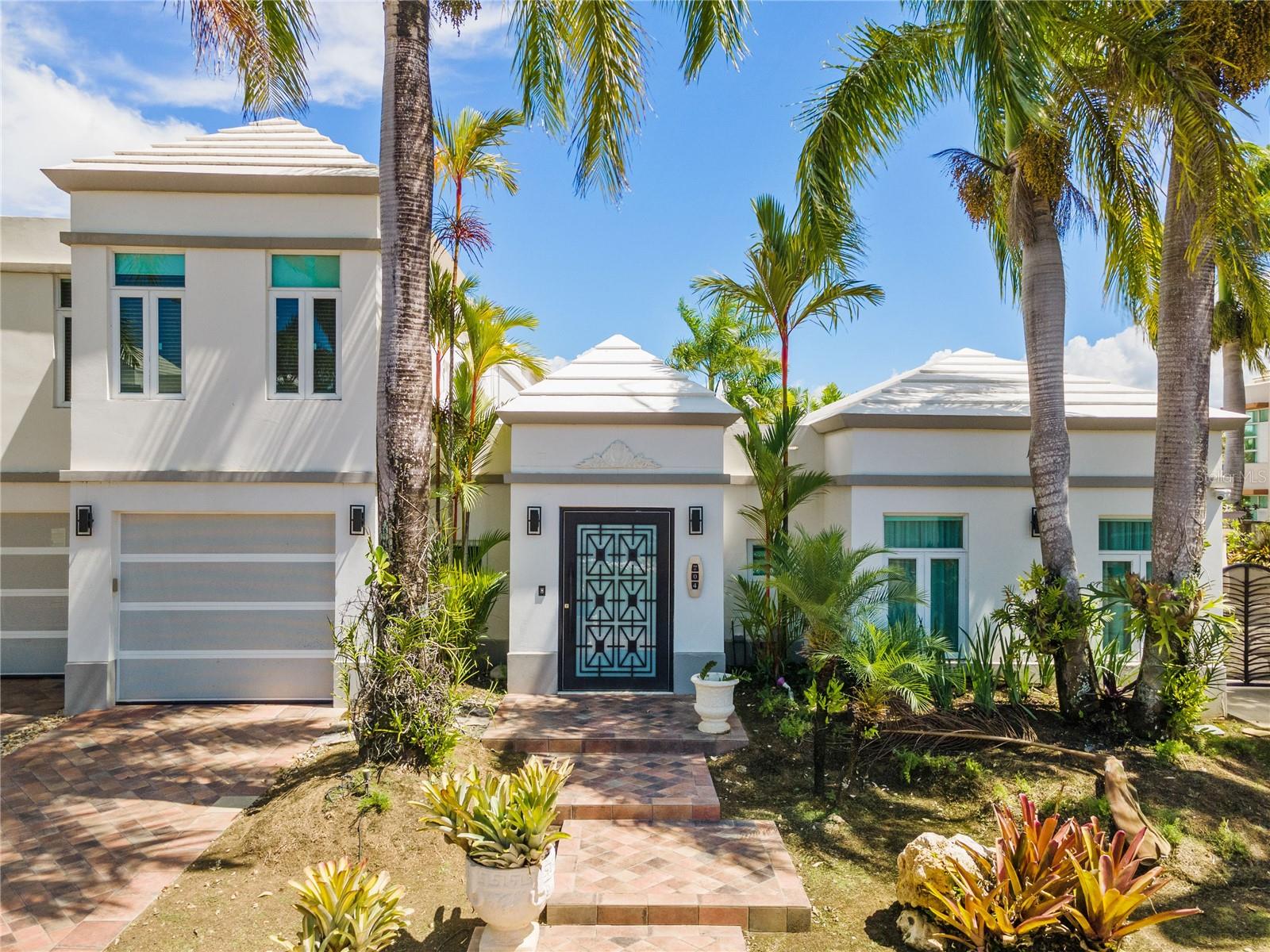 Discover Serene Tranquility in this Exceptional Residence Tucked Away in the Coveted Enclave of Paseo Las Palmas, Dorado, Puerto Rico.
Nestled within the private and secure confines of Paseo Las Palmas, this property offers an escape to peaceful living. With a generously sized lot spanning 892 square meters, this welcoming home comprises 4 bedrooms and 3.5 bathrooms, ensuring ample space for your family's comfort.
As you step outside, the inviting swimming pool beckons, providing a sanctuary to relax and absorb the tranquil surroundings. Here, you can unwind and rejuvenate amidst the serene ambiance.
Indoors, you'll find a wealth of modern conveniences, including stainless steel kitchen appliances that cater to your culinary desires. With a dependable 20Kwh generator, with 12 solar panels & 2 Tesla batteries, you'll be well-prepared for any situation. The property also boasts a water cistern, enhancing your peace of mind.
Elegance graces every corner of this residence, thanks to the Italian tiles that adorn the interior, adding a touch of sophistication to your daily life.
This home is the perfect synthesis of simplicity and luxury, offering a tranquil retreat that embraces the essence of peaceful living.
Escape to your own haven of serenity in the heart of Paseo Las Palmas.