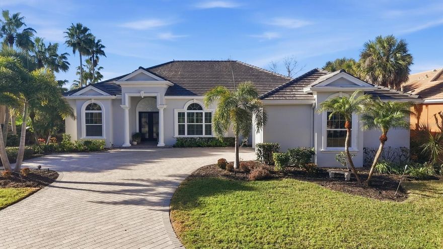 Experience elevated Florida living in this former Arthur Rutenberg model home, perfectly situated on a serene lake in the gated community of Boca Royale — and notably not located in a flood zone for added peace of mind. This elegant residence offers 4 bedrooms, a private office, 3 bathrooms, an oversized 2-car garage, and a brand-new roof (2025), combining comfort, quality, and long-term value.

An open-concept layout with soaring ceilings, leaded glass entry doors, and expansive sliders fills the home with natural light and showcases beautiful pool and lake views. The gourmet kitchen features a large center island, breakfast bar, coffee station, and ample space for entertaining. A split floor plan provides privacy, while a dedicated laundry room and office add everyday convenience.

Step outside to a resort-style lanai with two distinct living areas, a sparkling pool, and a fully equipped outdoor kitchen with Jenn-Air gas grill, wet bar, and beverage center — all overlooking tranquil water views.

Residents of Boca Royale enjoy access to golf, tennis, pickleball, fitness facilities, a clubhouse with dining, and a vibrant social calendar.

Schedule your private showing today.