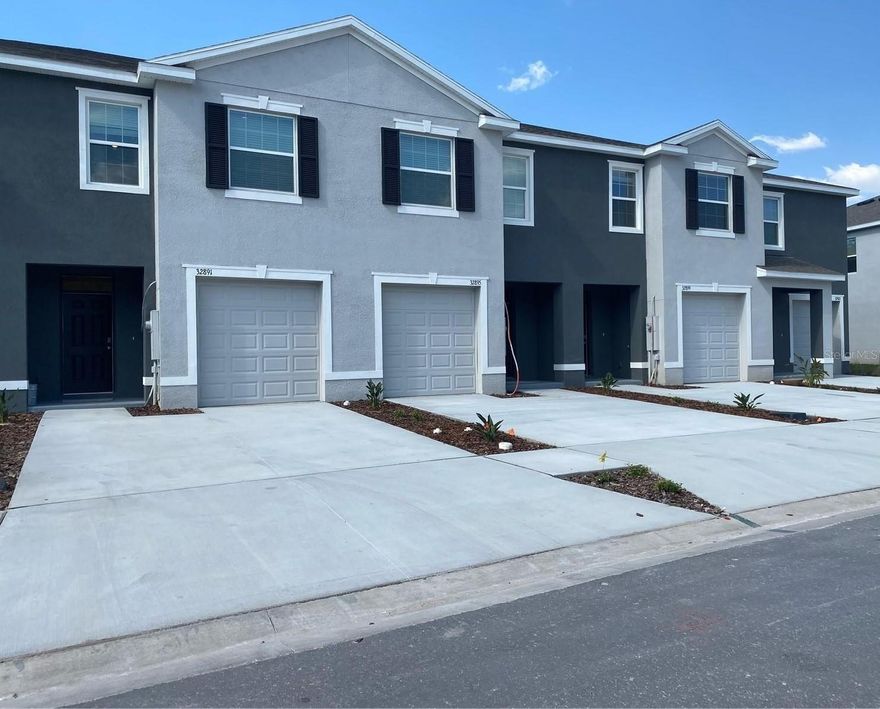 Beautiful 3-bedroom, 2.5-bath townhome, available immediately. The first level features tile flooring throughout, granite countertops, stainless steel appliances, and open dining and entertaining areas with ample storage. The home includes a one-car garage plus four additional driveway parking spaces. Step through the triple sliding glass doors to your private backyard patio—perfect for outdoor dining and entertaining—overlooking a peaceful preserve and pond. Upstairs offers a split floor plan with a spacious primary suite overlooking the pond, featuring two closets and an en-suite bathroom with double vanity and walk-in shower. Two additional bedrooms are located at the front of the home and share a full family tub bathroom. A convenient laundry closet with washer and dryer and a linen closet complete the second floor. Residents enjoy access to resort-style amenities, including an exclusive clubhouse with fitness center, sparkling pool, tot lot, open sports field, and scenic walking trails. Centrally located near major highways and less than 10 minutes from Wiregrass Mall, offering shopping, dining, entertainment, and local events. The highly regarded Union Park Academy is just a short walk away.