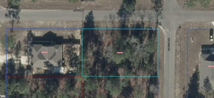 Flat buildable corner lot on two paved roads, new homes nearby!