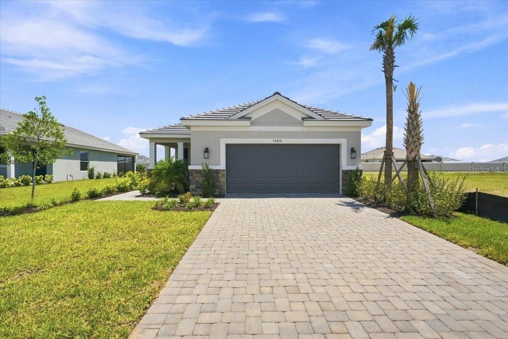 Photo of 13836 Fletcher Drive, Palmetto, FL 34221 (MLS # TB8543851)
