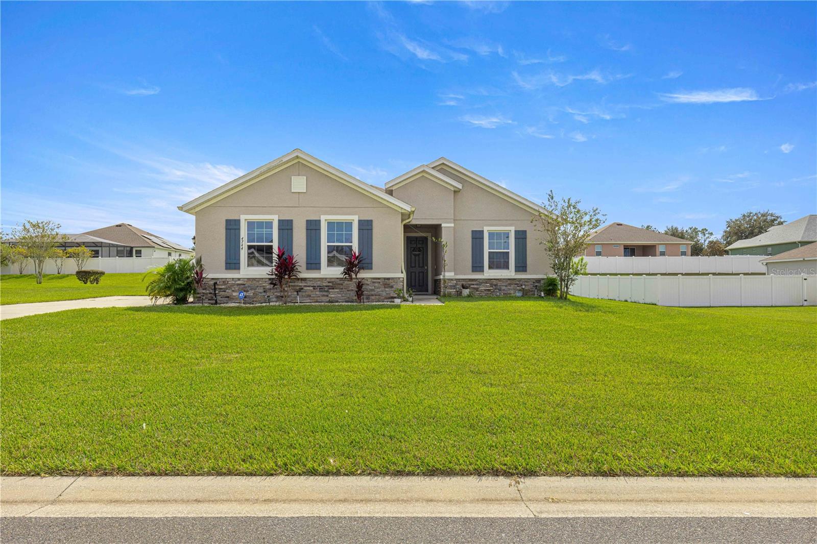 Welome to this stunning home in a gated community! With 4 bedrooms, 3.5 baths and a 3 car garage there is plenty of room for your family or visiting friends. The large living and dining areas are open to the chef's kitchen making this the perfect floor plan in which to entertain. The kitchen boasts granite counters and upgraded staggered cabinets. There is a in-law suite that features a bedroom and a bath. An attached bonus room can be used as a living area for the ILS or as an office/den/playroom etc. The two guest bedrooms are set in a Jack and Jill configuration. The large primary suite gives you a lot of room to spread out and create your own sanctuary. The property is partially fenced to give you privacy from the screened-in lanai. Best of all, this home has solar panels to keep your electric bills LOW! The home sits on an almost half acre site. Located in a community with a private gate, this home is a great combination of floor plan, wow factor and safety. Come see this home before it is too late!