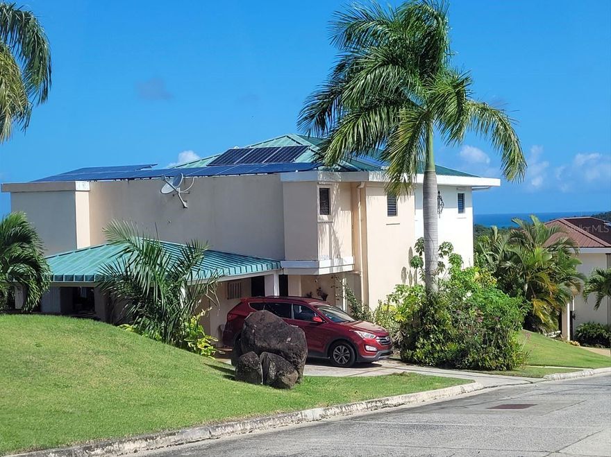 LARGE PROPERTY WITH MAJESTIC VIEWS spanning from the mountains of El Yunque National Forest to the beaches of Luquillo, Puerto Rico, USA. 

Current owners pay $75/month for home insurance and $65/month for property taxes.  The monthly initial expenses shown in Monthly Payment Calculators below are NOT accurate and have not been corrected after multiple requests so please utilize these correct figures in your analysis of this property. 

LOCATION, LOCATION, LOCATION: Property is located in the sought-after gated community of Hacienda Margarita in the beach town of Luquillo. The low $150 HOA includes 24-hour guard at gate, access to a lovely clubhouse, a semi-Olympic pool, tennis /pickleball courts, playground, and common area maintenance.  Hacienda Margarita is within 15 minutes of palm-studded beaches, Walmart, Walgreens, Petsmart, banks, supermarkets, cinemas, medical facilities, and restaurants, including the famed Luquillo kiosks. Trails and waterfalls of El Yunque rainforest are 20 minutes away.

Very easy access to PR-3; 40 minutes to Luis Muñoz Marín International Airport, 45 minutes to San Juan. There are several great marinas about 20 minutes away. The Ceiba Ferry Terminal is a 30 minute drive away, for getaways to the islands of Vieques and Culebra. 

THE PROPERTY: This approximately 2500 square feet 5-bedroom turnkey home on a 3000 square meter lot (about ¾ acre) on a hill could be your dream home! There are views from all terraces and most rooms. Huge covered terrace downstairs and open terrace above with panoramic views.  Beautifully remodeled and enlarged custom made kitchen with butler’s pantry, wet bar, quartz counters, termite-resistant Paraguayan cedar cabinets, and PVC interiors. Upstairs laundry room. Enlarged master bedroom (12’ X 18’) with large walk-in closet and access to upstairs terrace. Custom made his and her ensuite vanities and hall bathroom vanity. There are 2 ½ bathrooms upstairs and a half-bath downstairs. House has 6 mini-split inverter air conditioners. Fiber-optic connection for high-speed wi-fi internet access and streaming!  This home is constructed of cement blocks with cement foundation. All floors are ceramic tile. 

Property is ready for power and water outages! There are 29 solar panels with micro-inverters, a 14 kWh Tesla Powerwall II battery, all under warranty. Currently net metering with power company. Solar system status and activity are monitored via apps. There are 2 water tanks totaling 600 gallons filled by AAA (the water authority) for home use during water outages. There are 3 rain water collection tanks totaling 300 gallons. House also has a solar water heater.

Home includes an attached workshop/storage area, kitchen and laundry appliances, window treatments, hurricane shutters, gardening equipment and Ryobi 6500W generator. 

No neighbors behind! Large and flat back yard is suitable for a pool with gorgeous views. Approximately half the property is on a slope featuring flamboyan trees, beautiful heliconia flowers, and fruit trees. Halfway down the slope is a fairly flat area with views, suitable for a gazebo. Heirloom bananas and plantains are right in the back yard. 

SECURITY – AMENITIES – VIEWS – LOCATION – BEAUTIFUL HOME – What more could you ask for? This must-see property has it all! 

Property is being sold as-is and is not subject to appraisal. Pre-approval letter from a Puerto Rico lender required.  All reasonable offers will be considered.