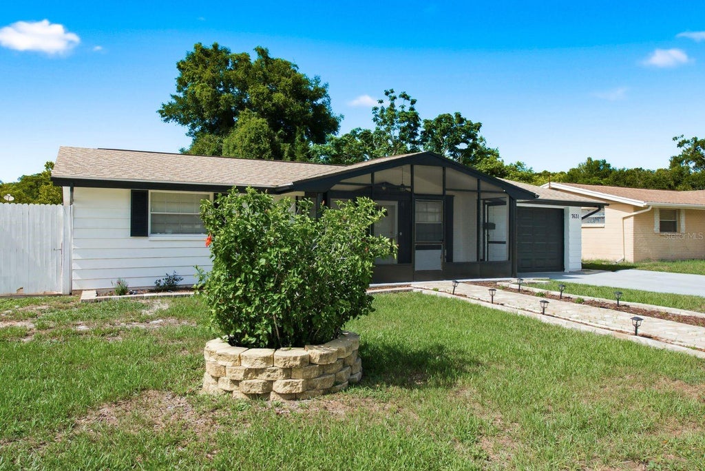 Photo of 7631 Hollyridge Drive, New Port Richey, FL 34653 (MLS # TB8530120)