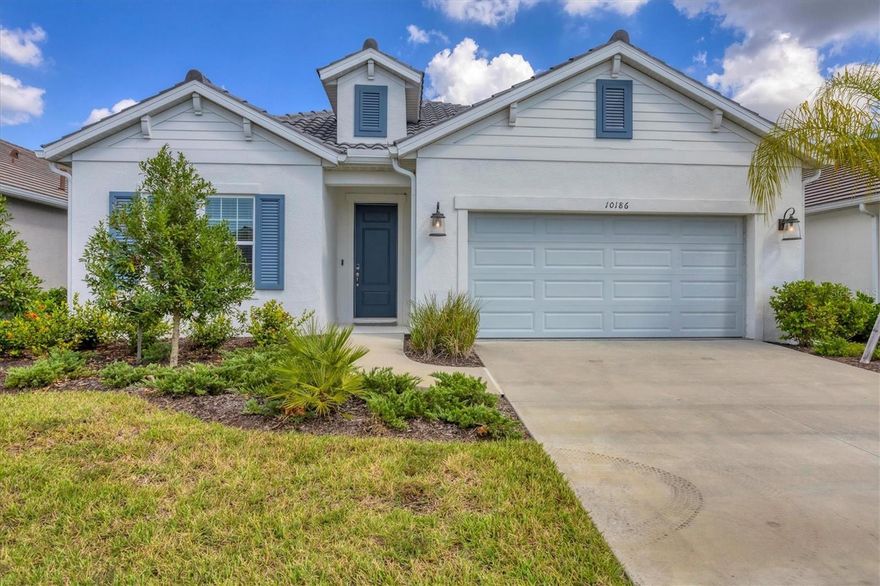 Discover 10186 Crystal Isle Circle, a beautifully appointed two-story home in Sarasota’s sought-after Grand Park community by Neal Communities. This spacious residence offers over 3,000 square feet of thoughtfully designed living space with 4 bedrooms, 4.5 bathrooms, an office/den, and a versatile upstairs bonus room.
The open-concept layout showcases elegant upgrades throughout, including quartz countertops, stainless steel appliances, designer cabinetry, and abundant natural light from large windows. The first-floor primary suite features two walk-in closets and a luxurious ensuite bath, while a guest bedroom with a private bath offers comfort and convenience.
Upstairs, the generous bonus room provides flexible space ideal for a media room, play area, or additional office. Enjoy peaceful moments on the covered lanai overlooking a serene natural preserve — the perfect backdrop for relaxing or entertaining.
Grand Park residents enjoy resort-style amenities including pools, tennis and pickleball courts, walking trails, a fitness center, and community clubhouse. With nearby top-rated schools, including the new Skye Ranch School, easy access to I-75, and the white sands of Siesta Key just minutes away, this home offers the best of Sarasota living.