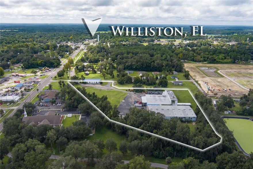Rare opportunity to own true industrial real estate within the City Limits of Williston Florida. This property consists of 3 large buildings totaling over 53,000 sq. ft. of building space situated on a large 6+ acre lot. The property’s current use is office and warehouse with current leases in place creating instant cashflow for the next owner. Each building has open warehouse space with multiple loading docks and office space giving plenty of room for high volume material/product deliveries and manufacturing/assembling space. Keep its current use or consider re-developing part or all of this property into desirable office, retail, restaurant, motel and more. Current owner had a feasibility study completed in 2019 detailing potential uses for this property. Buyer would be responsible for confirming redevelopment possibilities should they chose to do so. This property’s location in Williston Florida is highly desirable due to being only a 30-minute drive to both Gainesville and Ocala, making this great commercial space for anyone looking to grow their business into desirable markets like Alachua, Levy and Marion counties.