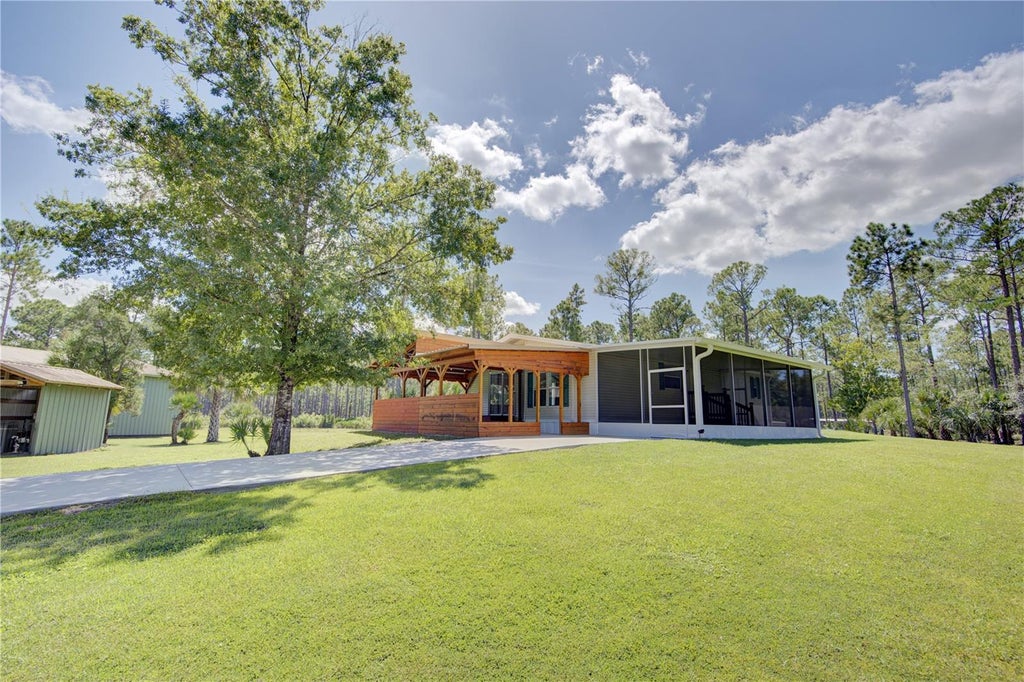 Photo of 420 Smith Road, Osteen, FL 32764 (MLS # O6445296)