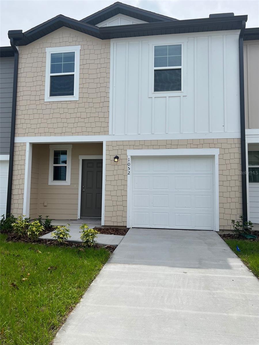 Welcome to this charming townhouse located in the desirable Madison Place community in Davenport, Florida! This spacious 3-bedroom, 2.5-bathroom home offers modern living in a convenient and peaceful setting. Step inside to an open and airy floor plan, where the inviting kitchen features plenty of counter space and cabinetry, perfect for preparing meals and entertaining. The seamless flow from the kitchen to the dining and living areas creates an ideal space for family gatherings and relaxation. The master suite is generously sized, complete with an ensuite bathroom for your privacy and convenience. Two additional bedrooms provide ample space for family, guests, or even a home office. The home also offers a well-appointed half-bathroom on the lower level for added convenience. Outside, you'll find a one-car garage, providing secure parking and additional storage space. The townhouse is situated in a well-maintained community, offering easy access to shopping, dining, schools, and major highways, making it a perfect spot for those who commute or enjoy weekend getaways to nearby attractions like Disney World and other Central Florida destinations. This townhouse in Madison Place is a fantastic opportunity for families, or anyone looking to enjoy a comfortable and low-maintenance lifestyle in a prime location. Don't miss your chance to call this home!