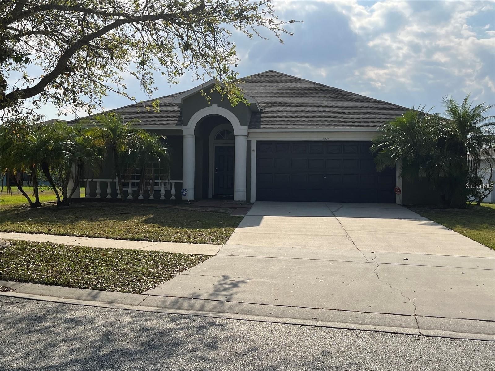 Beautiful one-story POOL HOME with an open floor plan, 4 bedrooms, and 2 bathrooms. New paint, professional carpet cleaning and new carpets in some areas. The spacious formal living room leads into a stunning kitchen with a high-top counter and breakfast area. The master suite includes a walk-in closet, large layout, and tub/shower combination. Three additional bedrooms and a second bathroom provide comfort and privacy. Outside, enjoy a fenced yard, in-ground pool, and oversized screened lanai—perfect for relaxing or entertaining. Rent includes pool service. Lawn care not included. Washer and dryer not included.