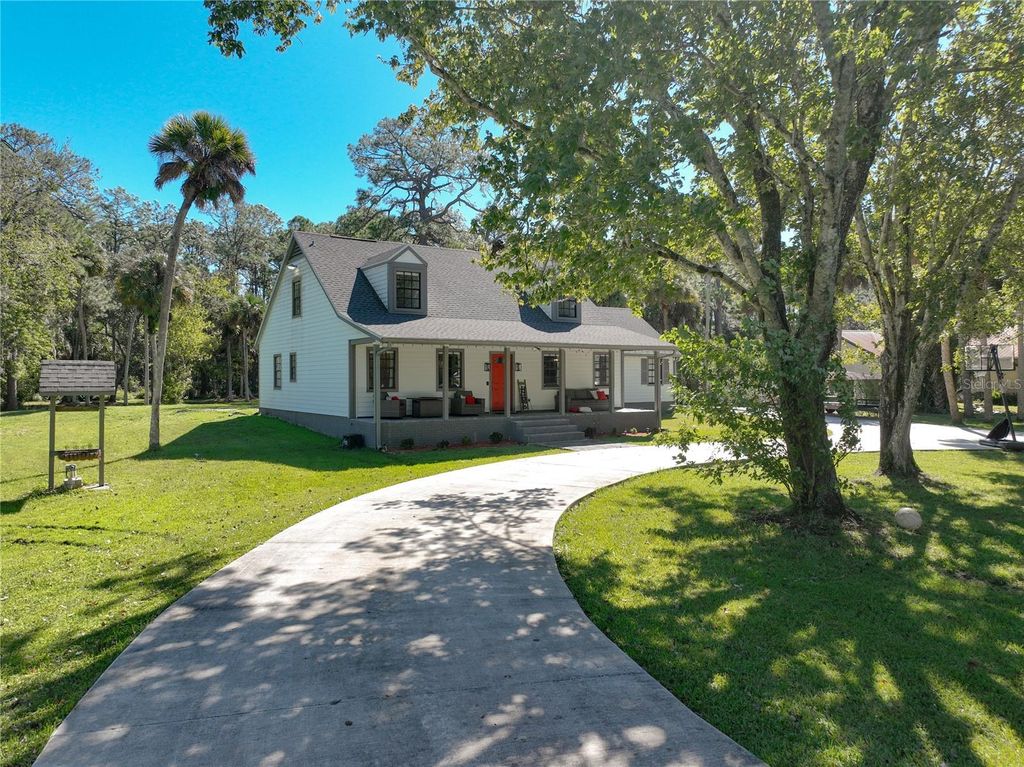 Photo of 7595 Turkey Point Drive, Titusville, FL 32780 (MLS # O6356809)