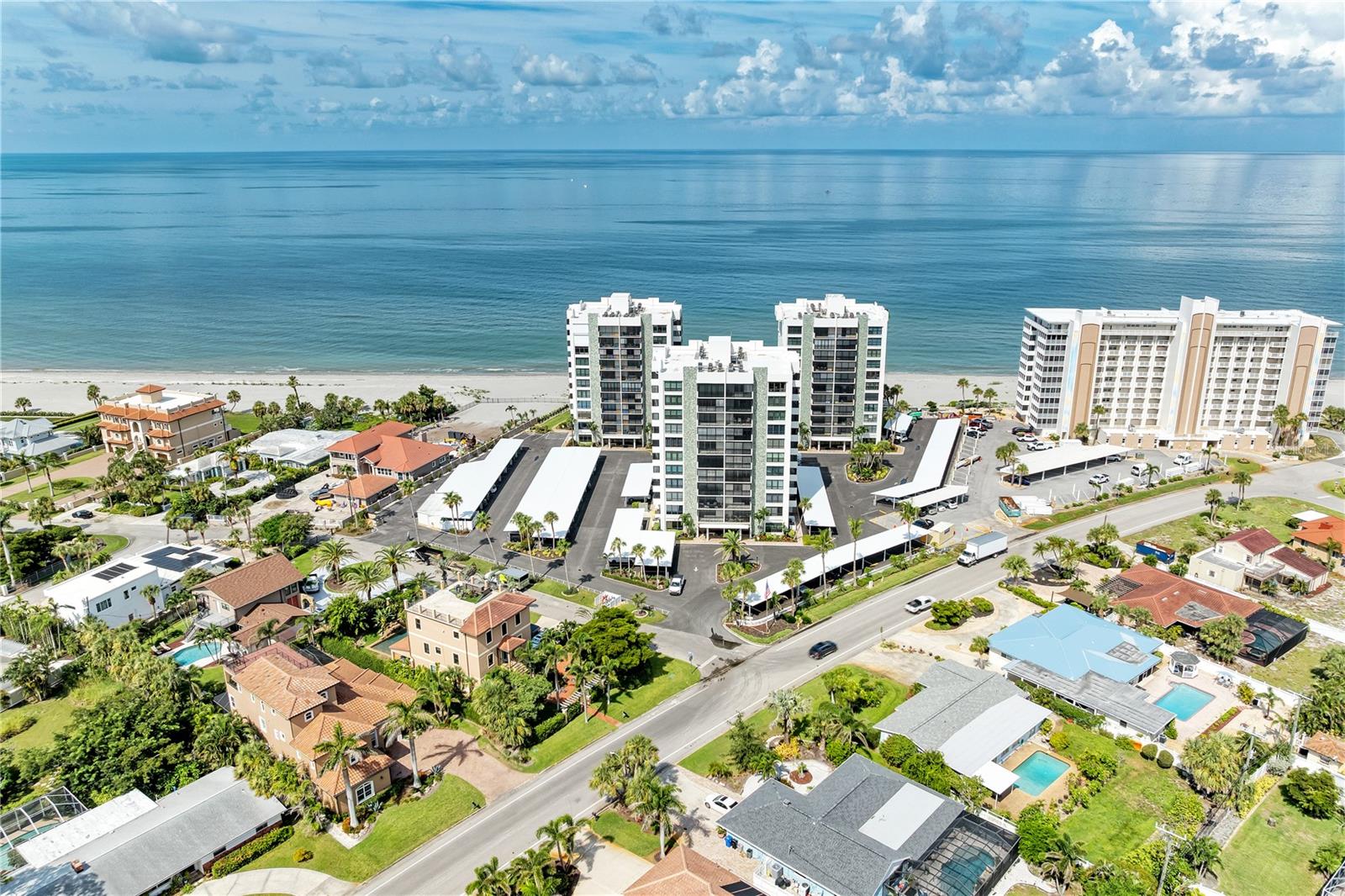 Live the coastal lifestyle in this beautifully updated 2-bedroom, 2-bathroom second-floor condo just steps from the Gulf beaches. Enjoy ocean views from both the living room and the private balcony off the primary bedroom. Step out onto the second East facing balcony off of the dining area offering additional outdoor space to relax and unwind. Recent updates within the last two years include new granite countertops in the kitchen, stainless steel appliances, a new water heater, fresh interior and exterior paint, and new carports. This move-in ready unit is being sold fully furnished, offering a true turn-key opportunity. Located only three miles from the world-famous Caspersen Beach—known as “Shark Tooth Beach”—and just one mile from the charming shops and restaurants of historic downtown Venice, this condo offers the perfect blend of comfort, convenience, and beachside living.