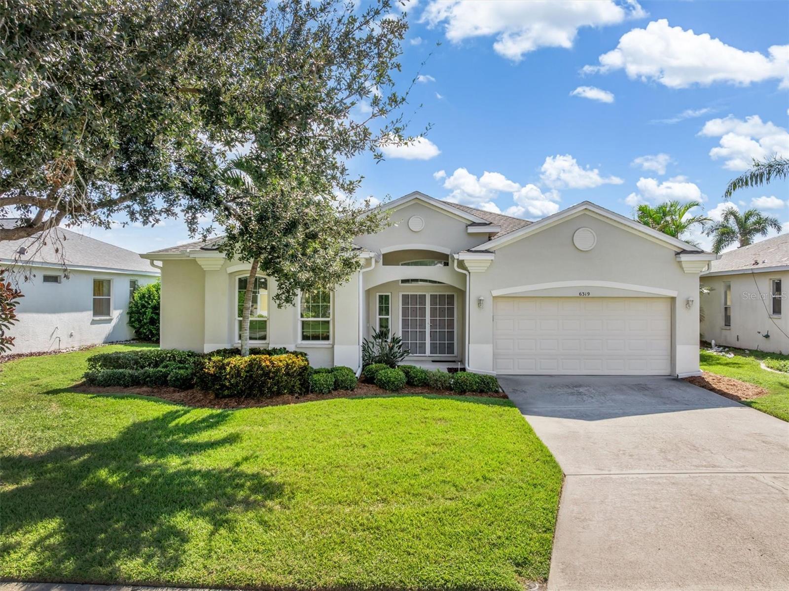 This charming Wellington Chase home is located in the heart of Palmer Ranch and features lovely lake views. This home has been lovingly cared for and meticulously maintained by its original owner. With three bedrooms and two bathroom as well as living and family rooms, this house has all the right spaces. One incredible upgrade to this home is impact windows and sliding glass doors installed in 2011. The garage door was replaced with an impact rated door in 2012. The roof was new in 2018, and the HVAC system was replaced in 2020. The water heater was replaced in 2022, and there is a surge protection system in place on the home as well! So the mechanicals of this home are in excellent condition and the interior is well-maintained and ready for your personal touches. The Wellington Chase location is perfect for watching the sunrise over the water from the screened-in back lanai. Palmer Ranch is known for its easy access to gulf beaches, the I-75 corridor, the Legacy trail and is bordered by shopping centers at nearly every corner! You will love the convenience of the location, not to mention the excellent school district. This home represents a great opportunity, schedule your private showing today!