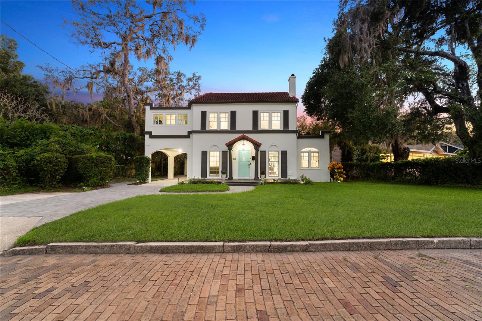 One or more photo(s) has been virtually staged. This impeccably restored 1920s residence, inspired by the timeless designs of Italian architect Andrea Palladio, seamlessly blends historic charm with contemporary luxury.
Set on a rare double lot shaded by mature Live Oaks and framed by picturesque brick streets, the home offers dual street access and has undergone a meticulous, full-scale renovation. Every inch was thoughtfully reimagined both levels reconfigured to maximize functionality, natural light, and flow while original architectural details were carefully preserved. High ceilings contribute to the home's open, airy feel.
The main residence features a flexible layout with three generously proportioned bedrooms and three-and-a-half bathrooms. A detached, fully self-contained one-bedroom, one-bath guest house complete with a private entrance and full kitchen offers ideal accommodations for guests, extended stays, or income generating opportunities.
All three newly built bathrooms in the main home feature frameless glass walk-in showers, elegant stone countertops, and premium fixtures. Major system upgrades include new plumbing, electrical, ductwork, and HVAC. Energy efficiency was a priority throughout, with features such as R-38 attic insulation, a tankless water heater, double-pane Pella windows, and custom doors and hardware.
The lanai, equipped with motorized shades, offers both privacy and convenience blending indoor comfort with outdoor elegance.
At the heart of the home lies a chef’s kitchen designed for both beauty and performance. Highlights include a custom island, integrated gas cooktop, Dacor double ovens, and bespoke cabinetry. A floor-to-ceiling sliding glass wall seamlessly connects the interior to a covered lanai and a newly rebuilt 16' wide by 32' long saltwater pool, 8 feet deep, featuring brand-new piping and mechanical systems not typically found in new construction. The home includes three distinct living areas, a formal dining room, and a spacious eat-in kitchen. A sunlit home office and a large laundry room with stone countertops, deep sink, and custom cabinetry add exceptional functionality. A centrally located powder room provides added convenience for guests.
Upstairs, the expansive primary suite offers a spa-inspired retreat. The luxurious bath includes a soaking tub, a walk-in shower adorned with Italian Calacatta Gold porcelain tile, champagne gold fixtures, dual Kohler sinks, and Cambria quartz countertops. A custom walk-in closet completes the suite’s refined ambiance.
Two additional upstairs bedrooms each include en suite bathrooms, offering comfort and privacy for family or guests.
Ideally situated just steps from Lake Lawsona and within a short distance of Lake Eola, Thornton Park, Orlando Health, the Orlando Arena, and the Dr. Phillips Center, the home provides effortless access to Orlando’s most vibrant destinations. Nearby Winter Park adds to the appeal with its scenic parks, upscale boutiques, renowned art galleries, and acclaimed dining. Cultural institutions like the Morse Museum, Winter Park Historical Museum, and Central Park are also close at hand, along with the Winter Park Golf and Country Club and the Winter Park Chain of Lakes.
With Michelin-rated restaurants, a popular Sunday farmers market, SunRail access, and Orlando International Airport just minutes away, this exceptional home presents a rare opportunity to own a landmark property where architectural heritage, modern luxury, and urban convenience intersect.